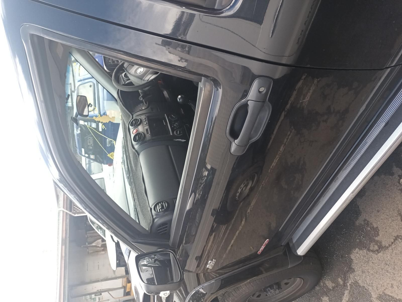 A Black Truck with the Door Open is Parked in a Parking Lot — South West 4WD Wreckers In Brisbane, QLD