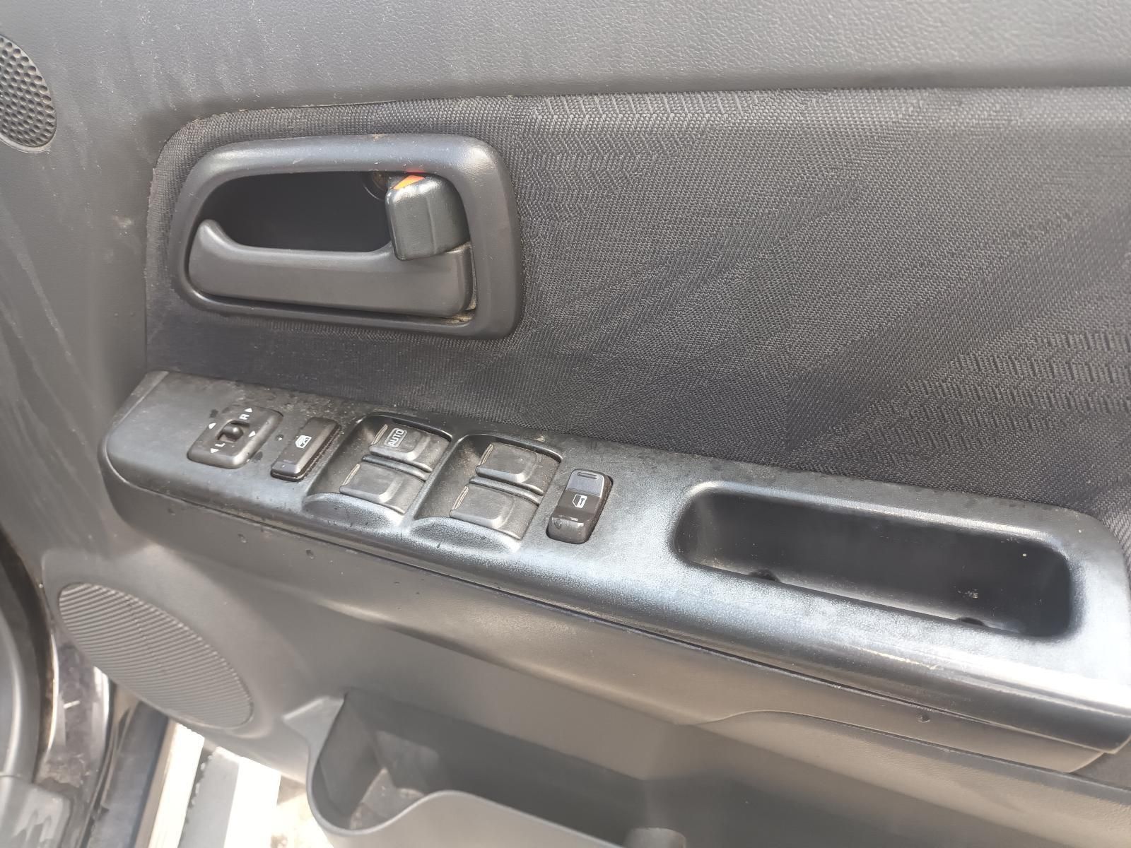 A Close Up of a Car Door with a Handle and Buttons — South West 4WD Wreckers In Brisbane, QLD