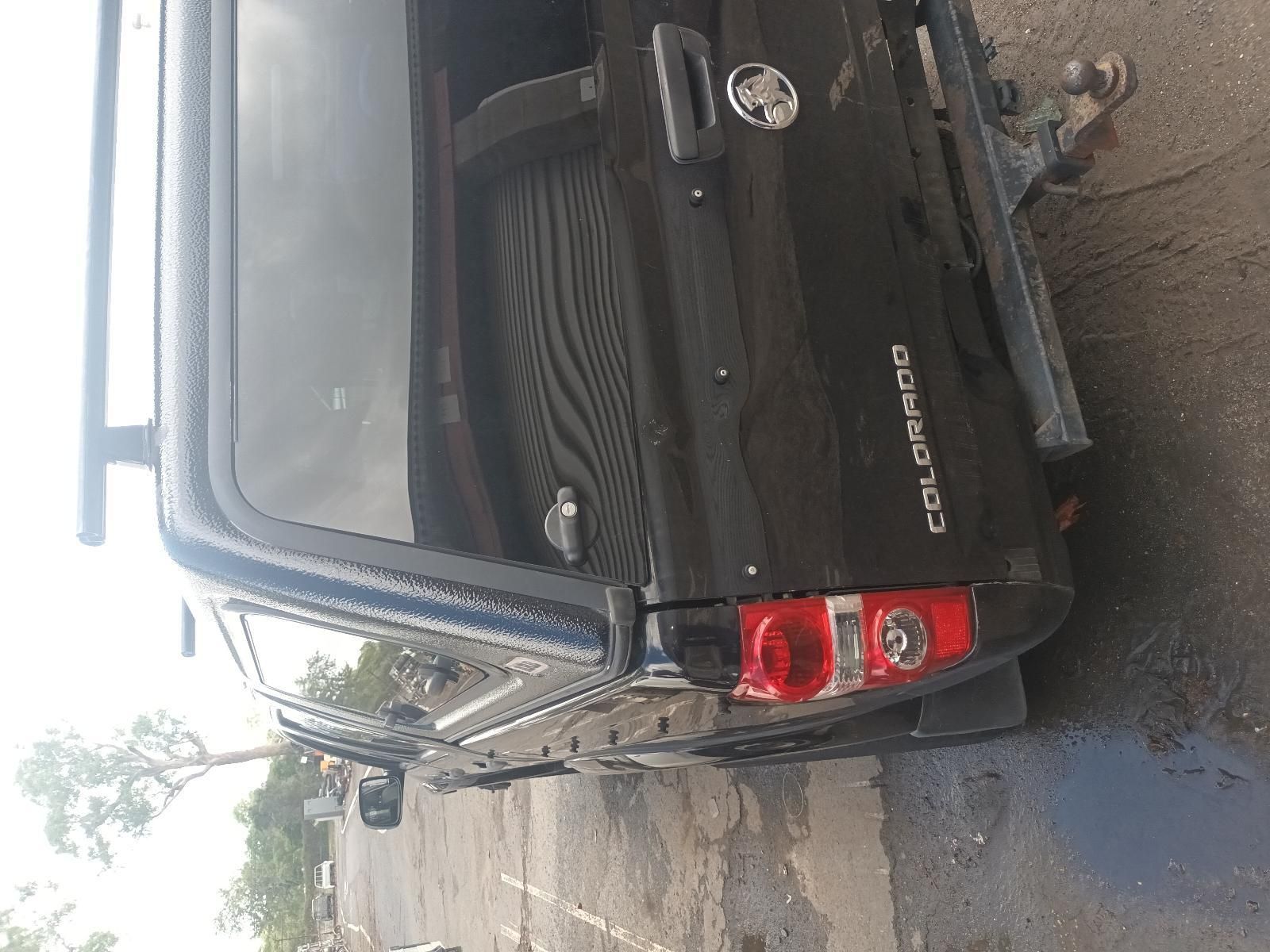 A Black Truck is Parked on the Side of the Road — South West 4WD Wreckers In Brisbane, QLD