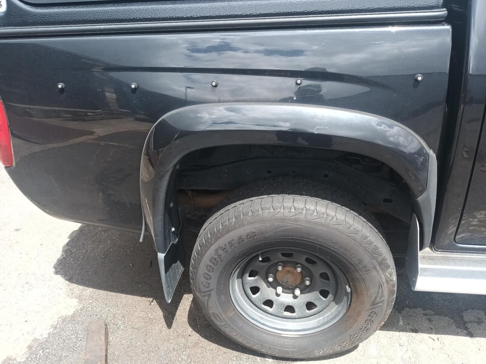 A Black Truck is Parked on the Side of the Road — South West 4WD Wreckers In Brisbane, QLD
