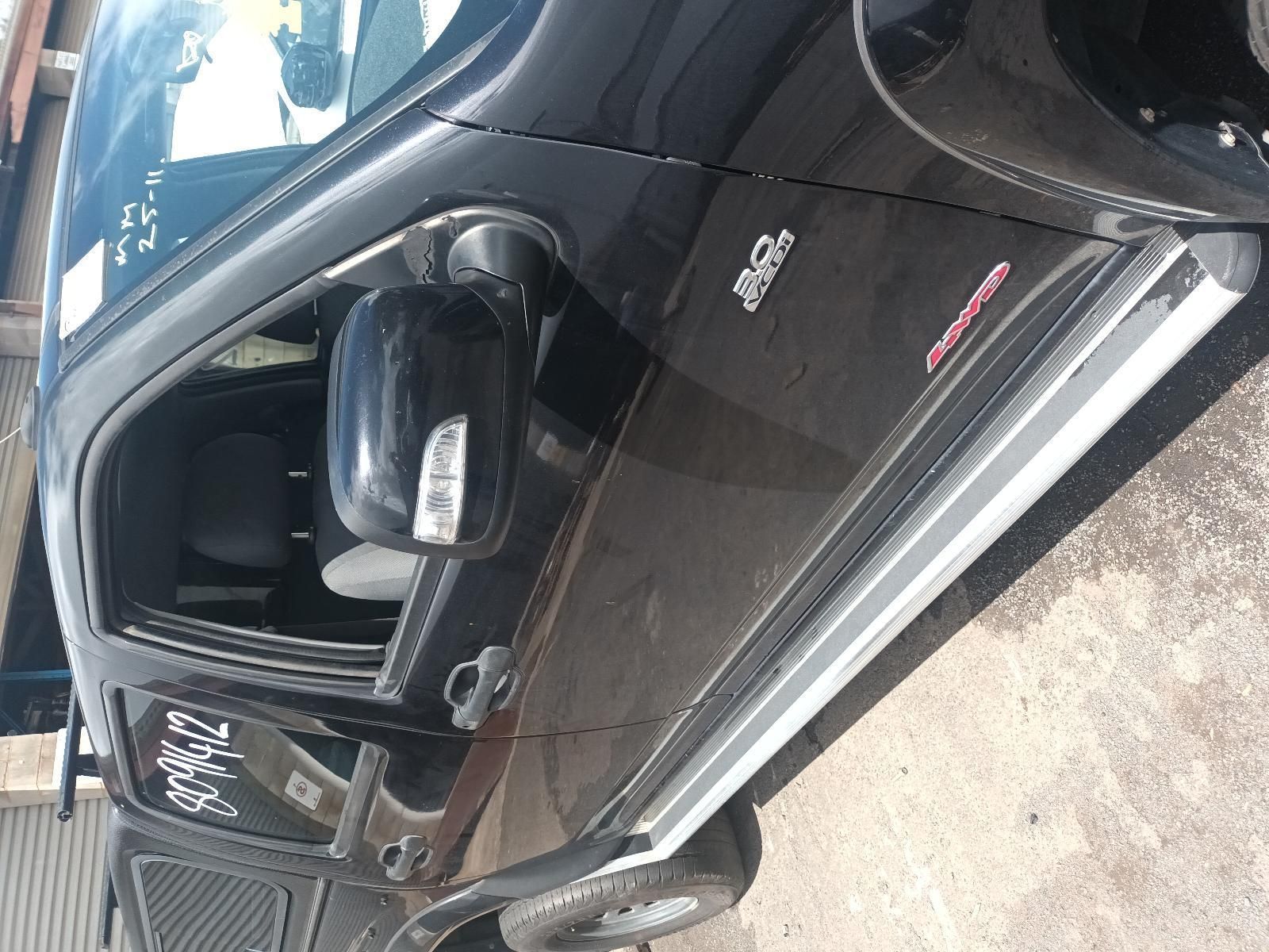 A Black Truck is Parked on the Side of the Road — South West 4WD Wreckers In Brisbane, QLD