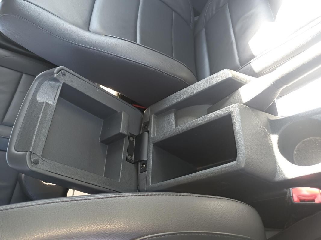 A Car Console with the Lid Open and a Cup Holder — South West 4WD Wreckers in Harristown, QLD