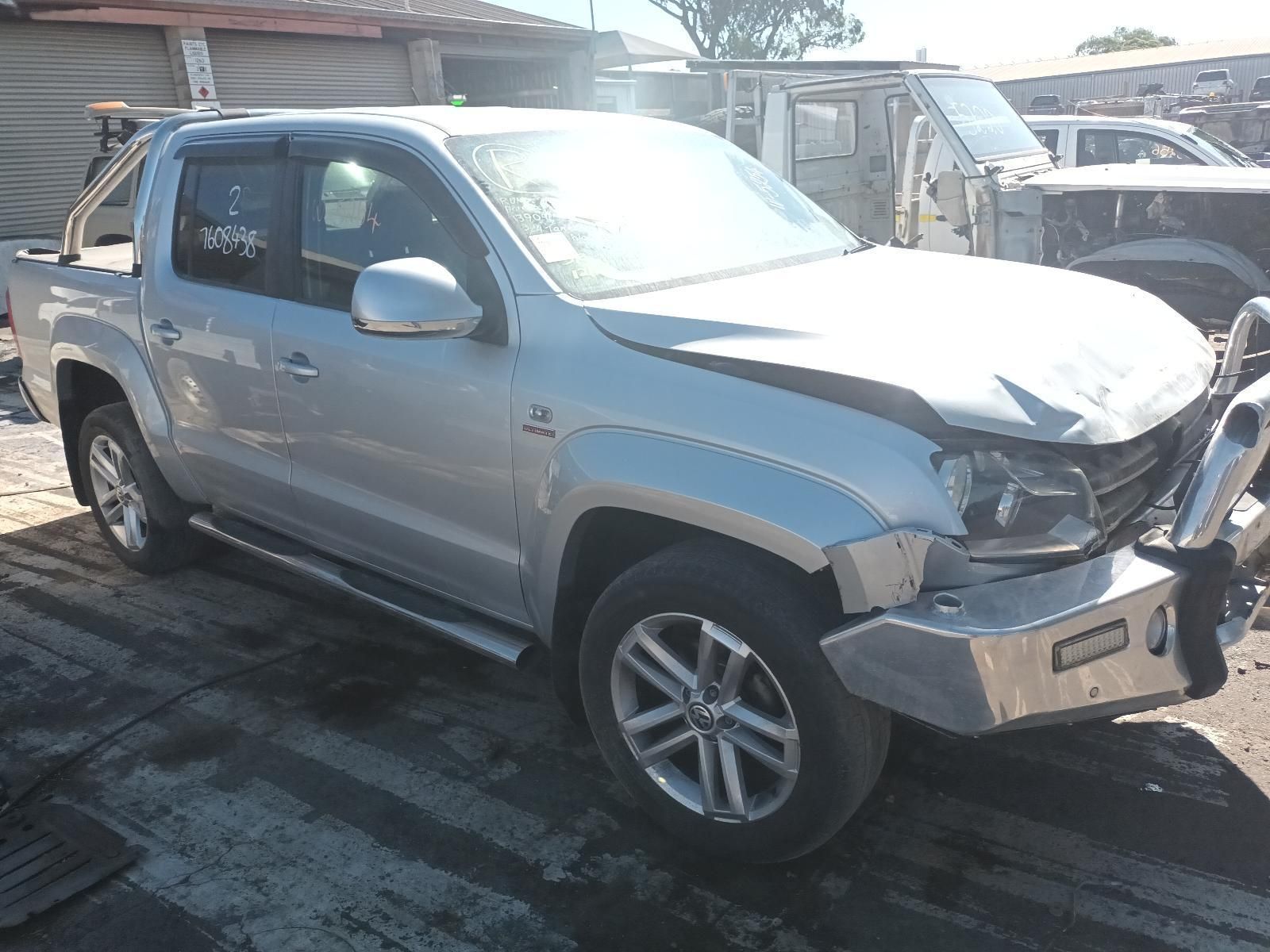 A Silver Truck with a Broken Bumper is Parked in a Parking Lot — South West 4WD Wreckers in Harristown, QLD