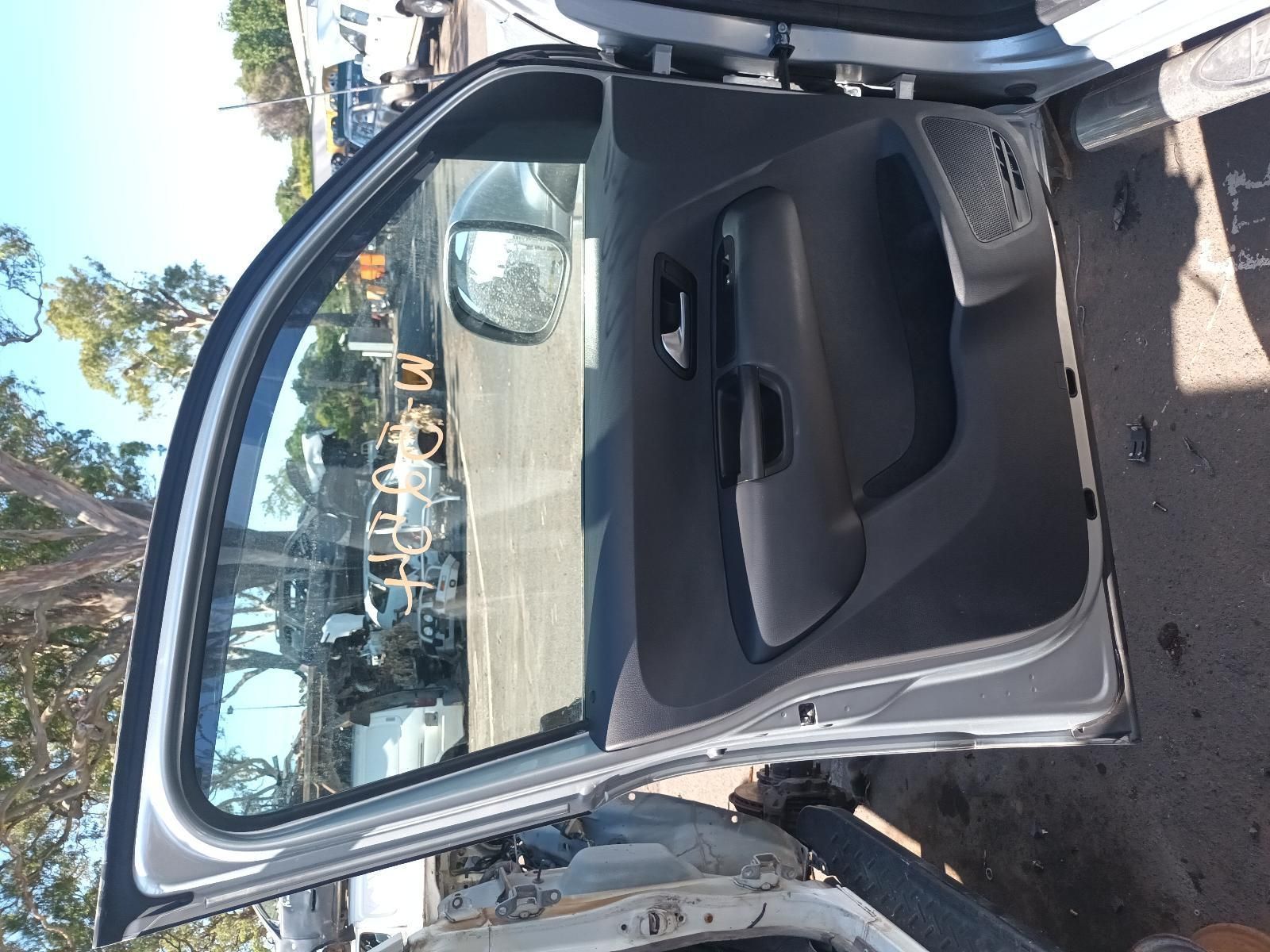 The Door of a Car is Open and Sitting on the Ground — South West 4WD Wreckers in Harristown, QLD