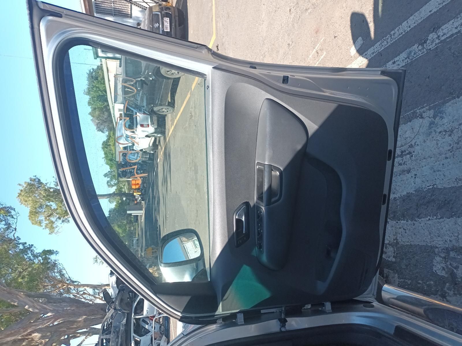 A Car is Parked in a Parking Lot with the Door Open — South West 4WD Wreckers in Harristown, QLD