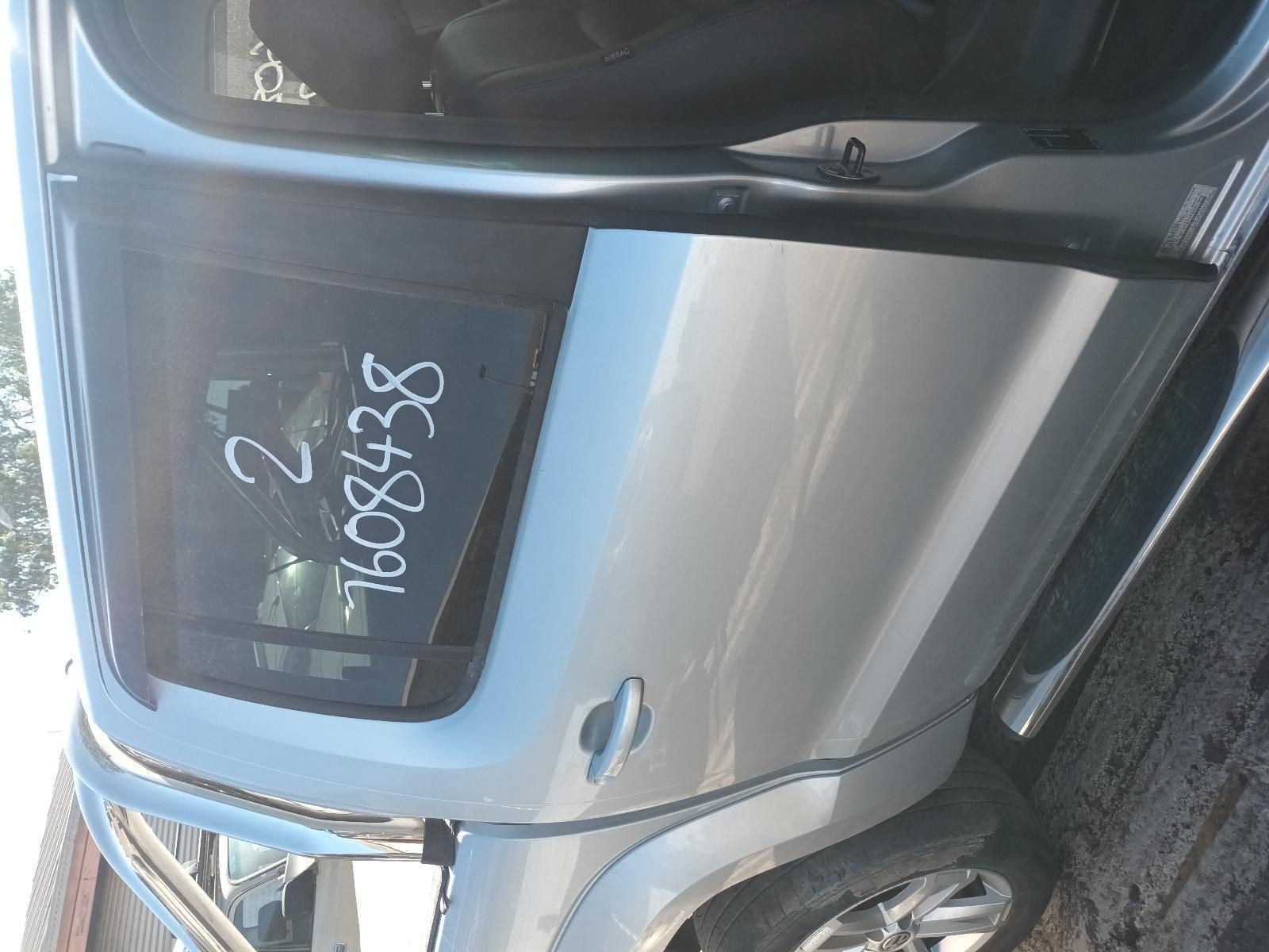 A Silver Car with the Numbers Written on the Door — South West 4WD Wreckers in Harristown, QLD