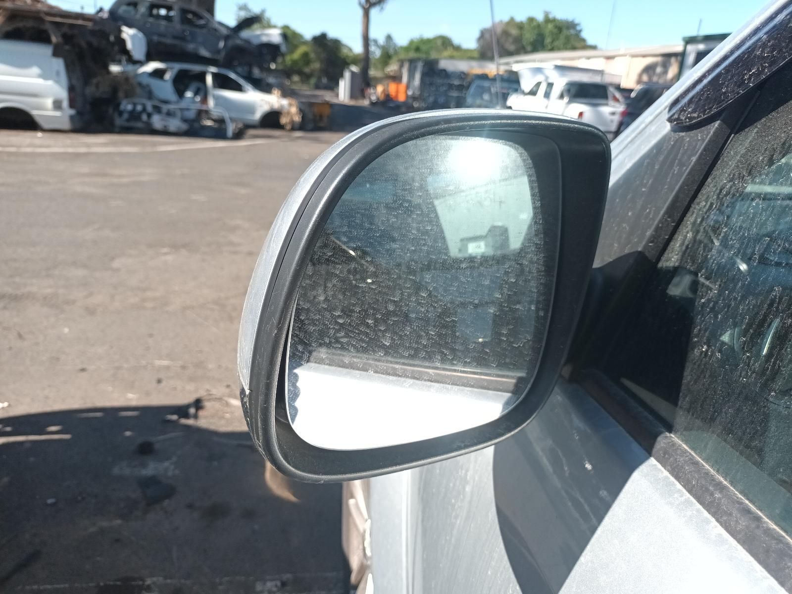 A Silver Car is Parked in a Parking Lot with a Lot of Cars in the Background — South West 4WD Wreckers in Harristown, QLD