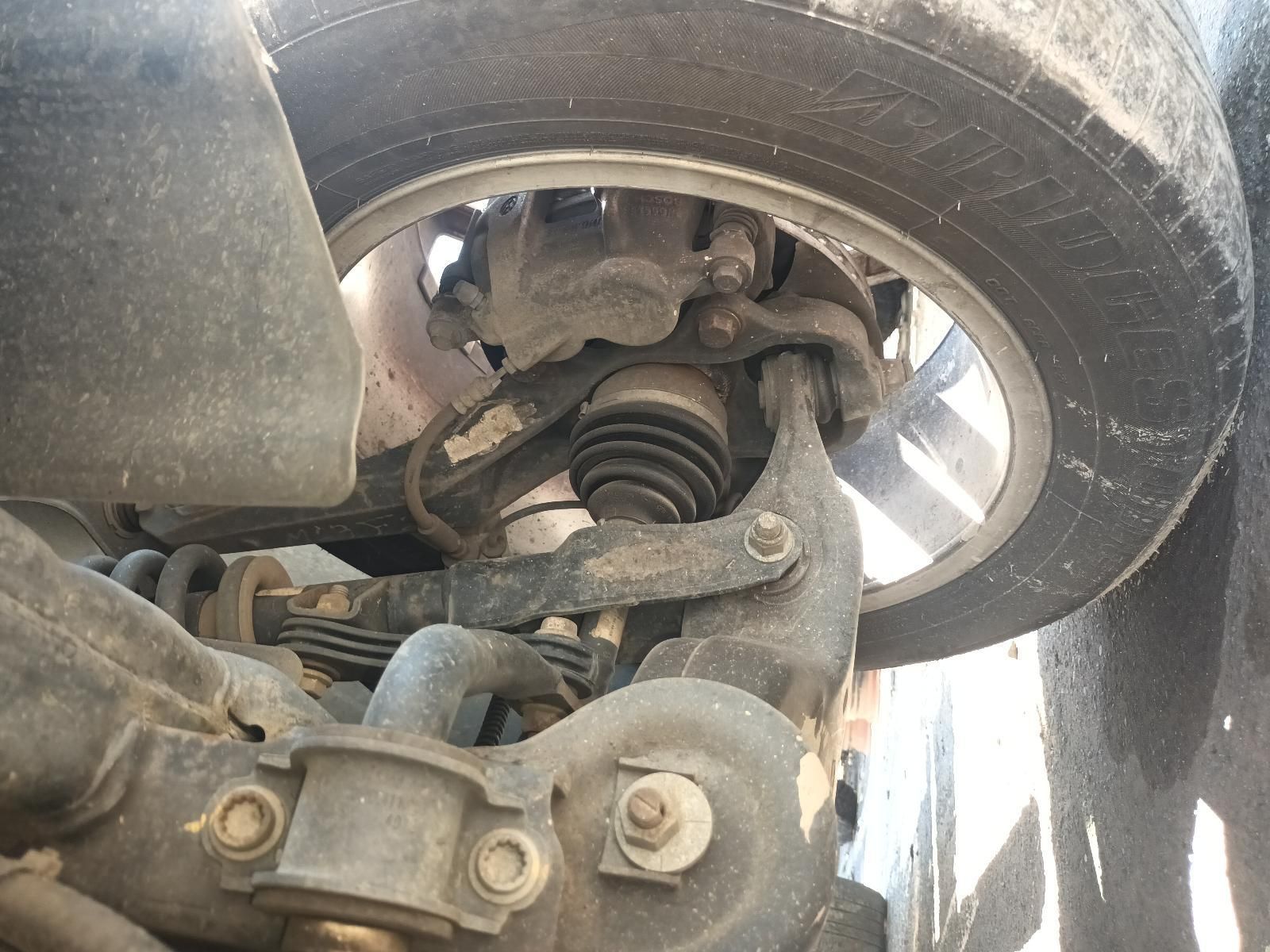 A Close Up of the Underside of a Car with a Tire on It — South West 4WD Wreckers in Harristown, QLD