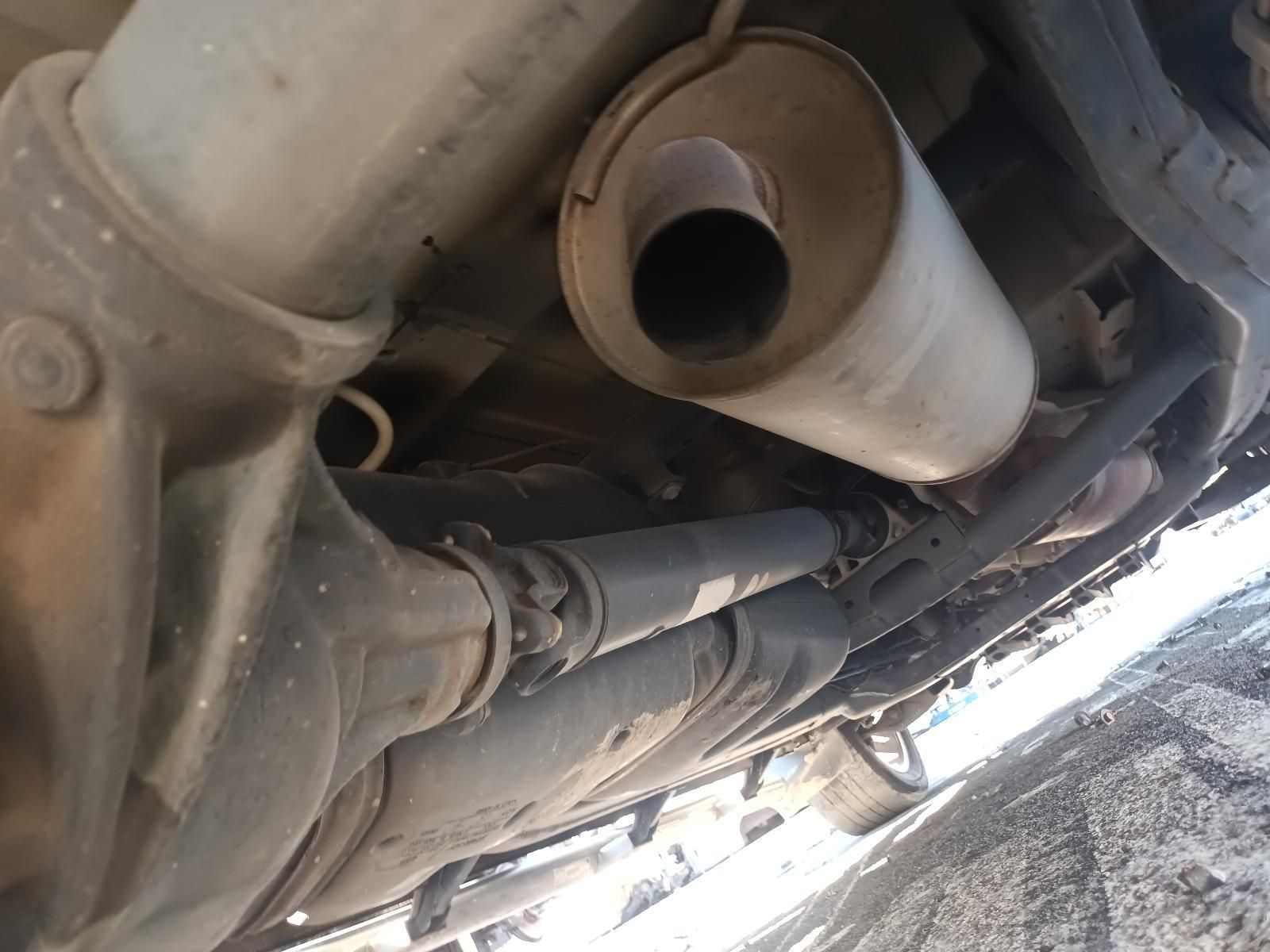 A Close Up of a Car Exhaust Pipe Underneath It — South West 4WD Wreckers in Harristown, QLD
