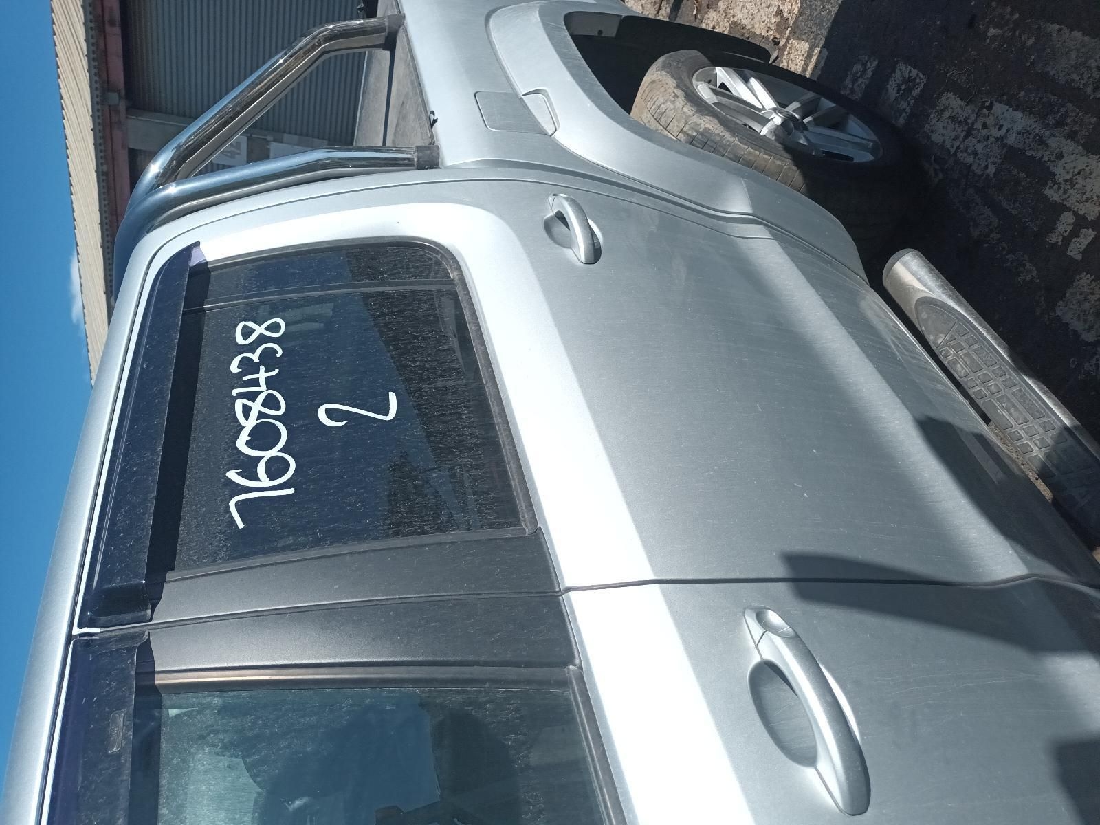 A Silver Car with the Numbers Written on the Door — South West 4WD Wreckers in Harristown, QLD