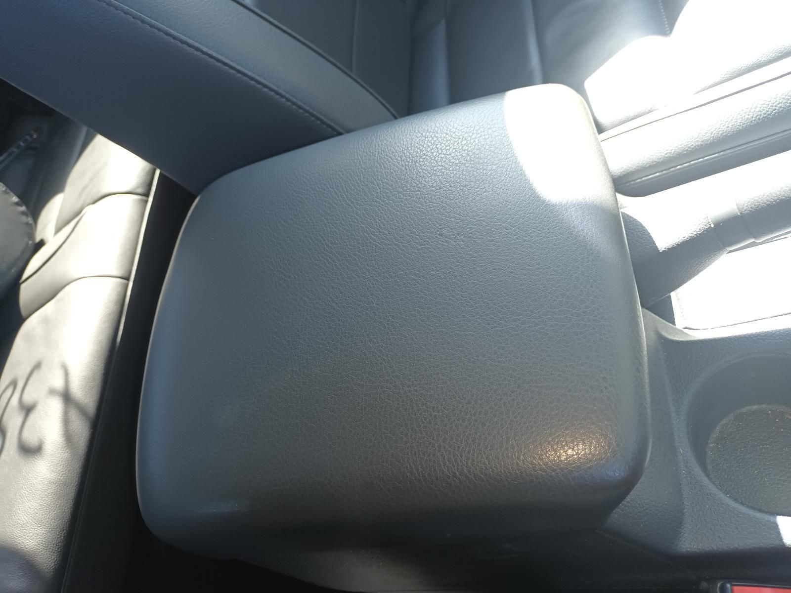 A Black Arm Rest in a Car with a Cup Holder — South West 4WD Wreckers in Harristown, QLD