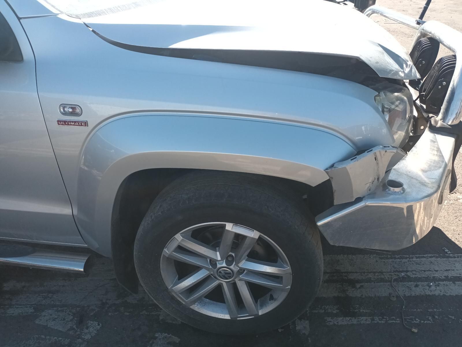 A Silver Truck with a Damaged Hood is Parked on the Side of the Road — South West 4WD Wreckers in Harristown, QLD