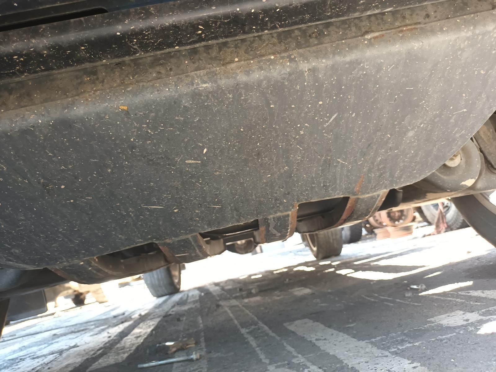 A Black Car is Parked on the Side of the Road — South West 4WD Wreckers in Harristown, QLD