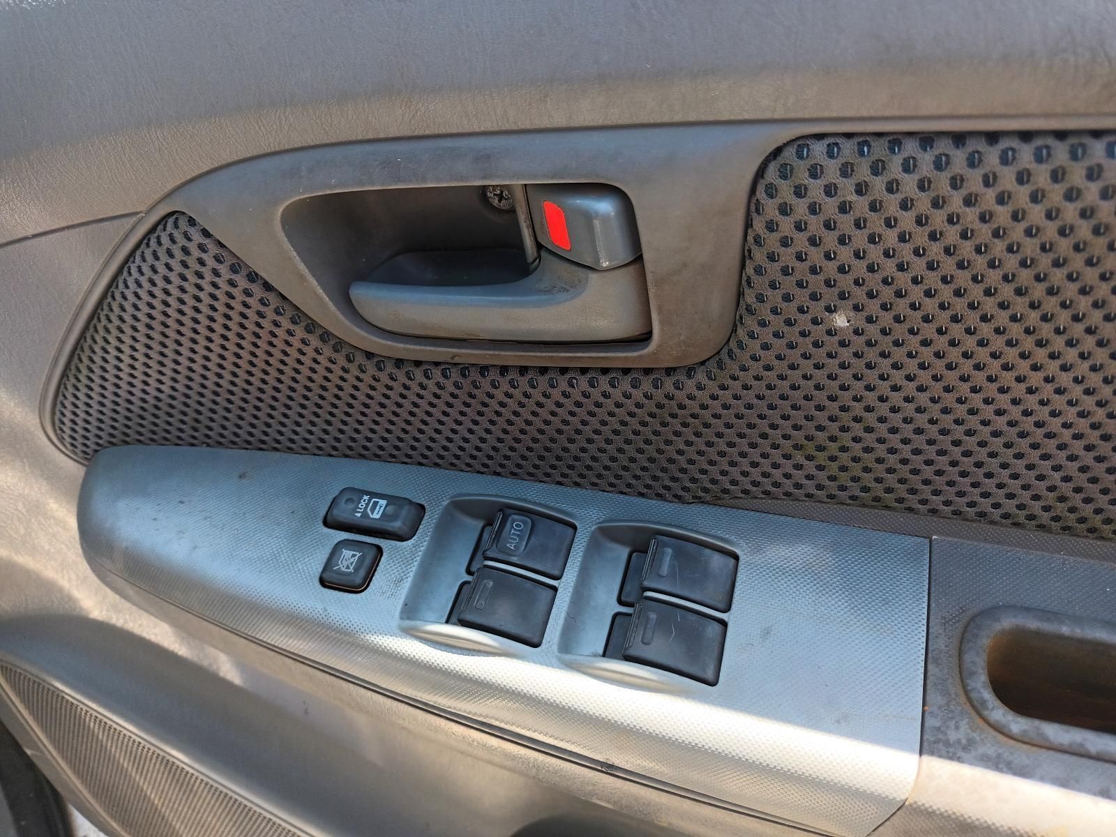 A Close Up of a Car Door with a Handle and Buttons — South West 4WD Wreckers in Harristown, QLD