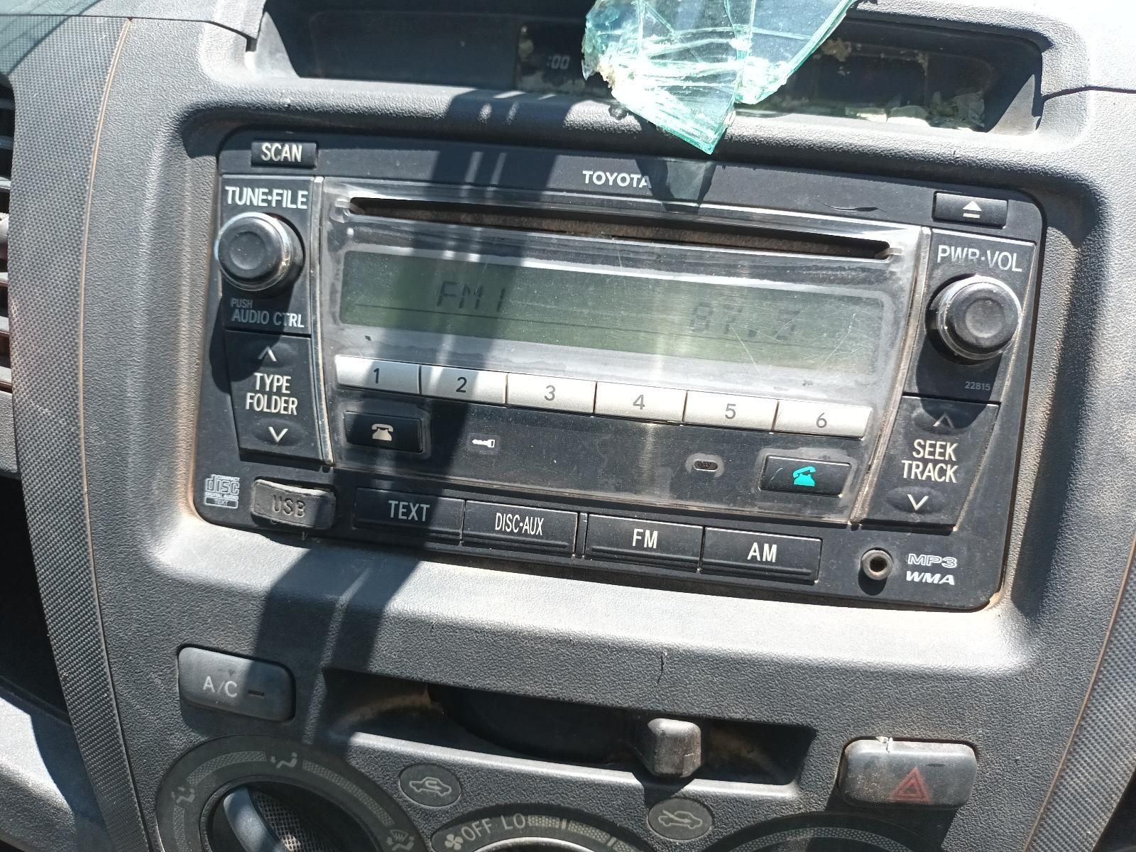 A Toyota Radio is Sitting on the Dashboard of a Car — South West 4WD Wreckers in Harristown, QLD
