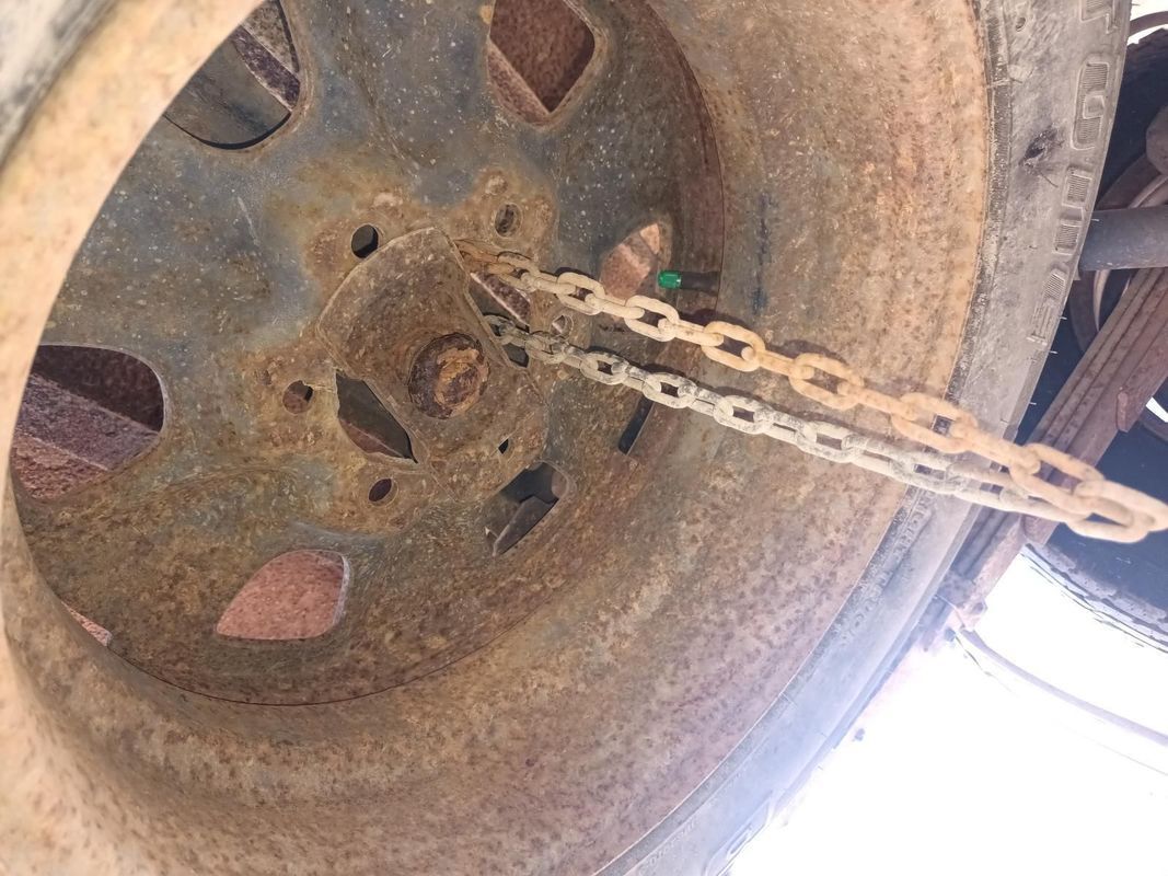 A Close Up of a Tire with a Chain Attached to It — South West 4WD Wreckers in Harristown, QLD