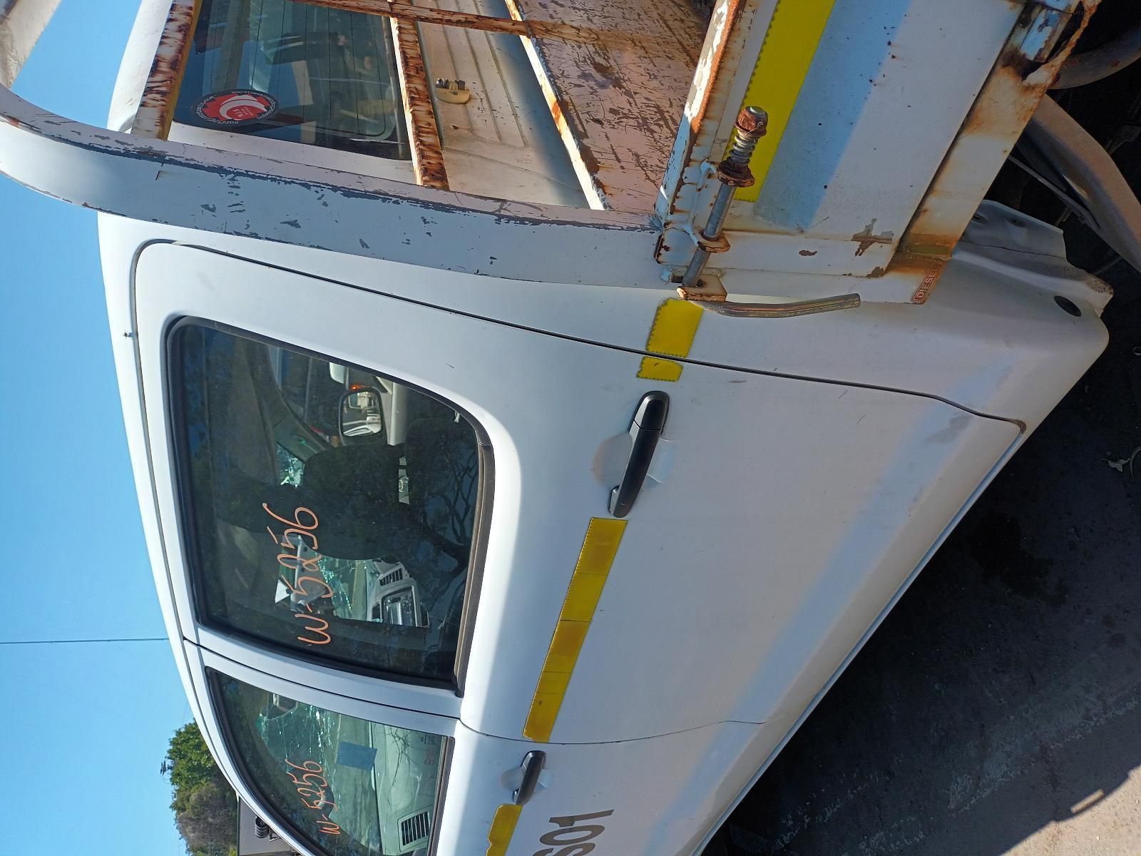 A White Truck is Parked on the Side of the Road — South West 4WD Wreckers in Harristown, QLD