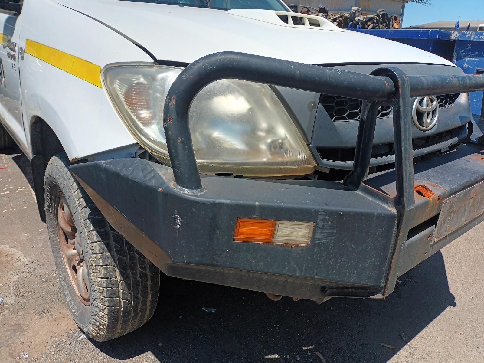 A White Truck with a Black Bumper is Parked on the Side of the Road — South West 4WD Wreckers in Harristown, QLD