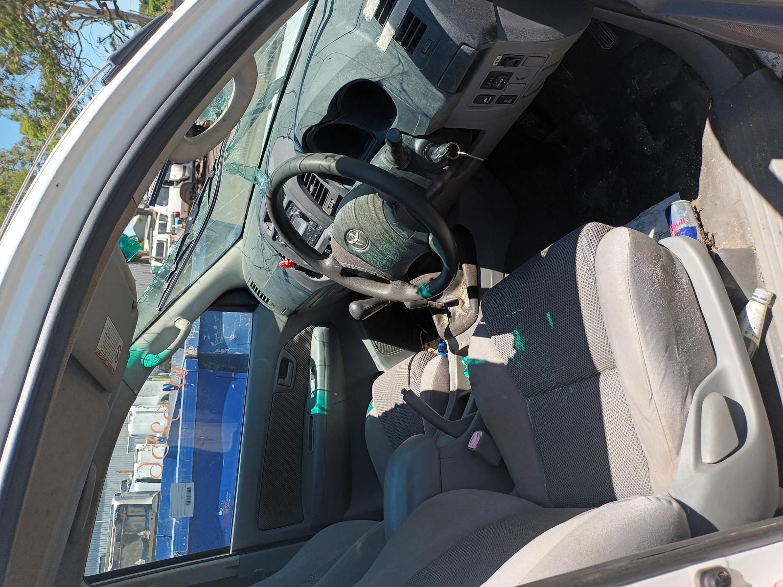 A White Car with a Broken Steering Wheel and Seats — South West 4WD Wreckers in Harristown, QLD