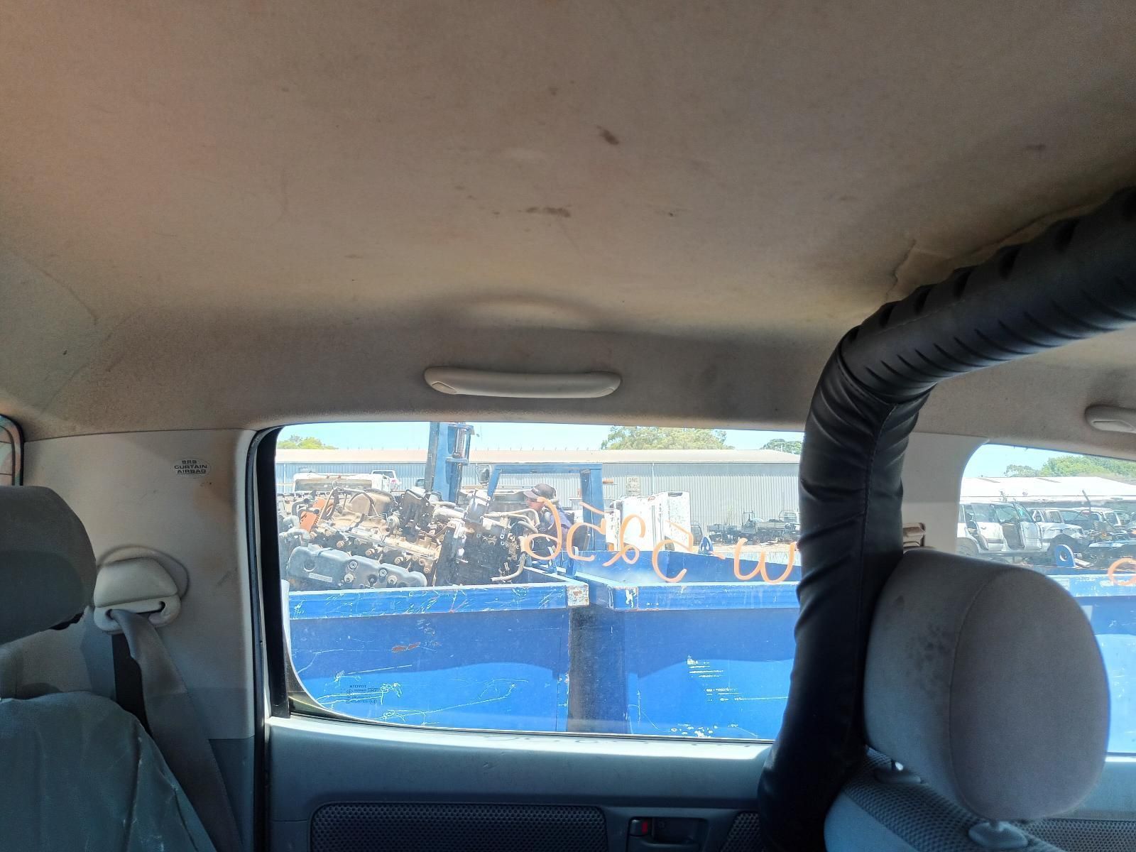 The Inside of a Car with a Blue Truck in the Background — South West 4WD Wreckers in Harristown, QLD