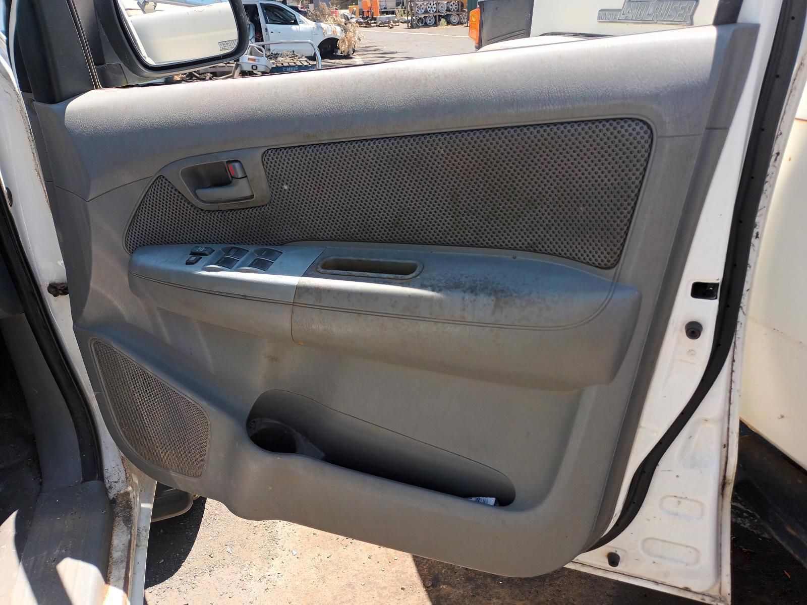 A White Car with the Door Open and a Gray Door Panel — South West 4WD Wreckers in Harristown, QLD