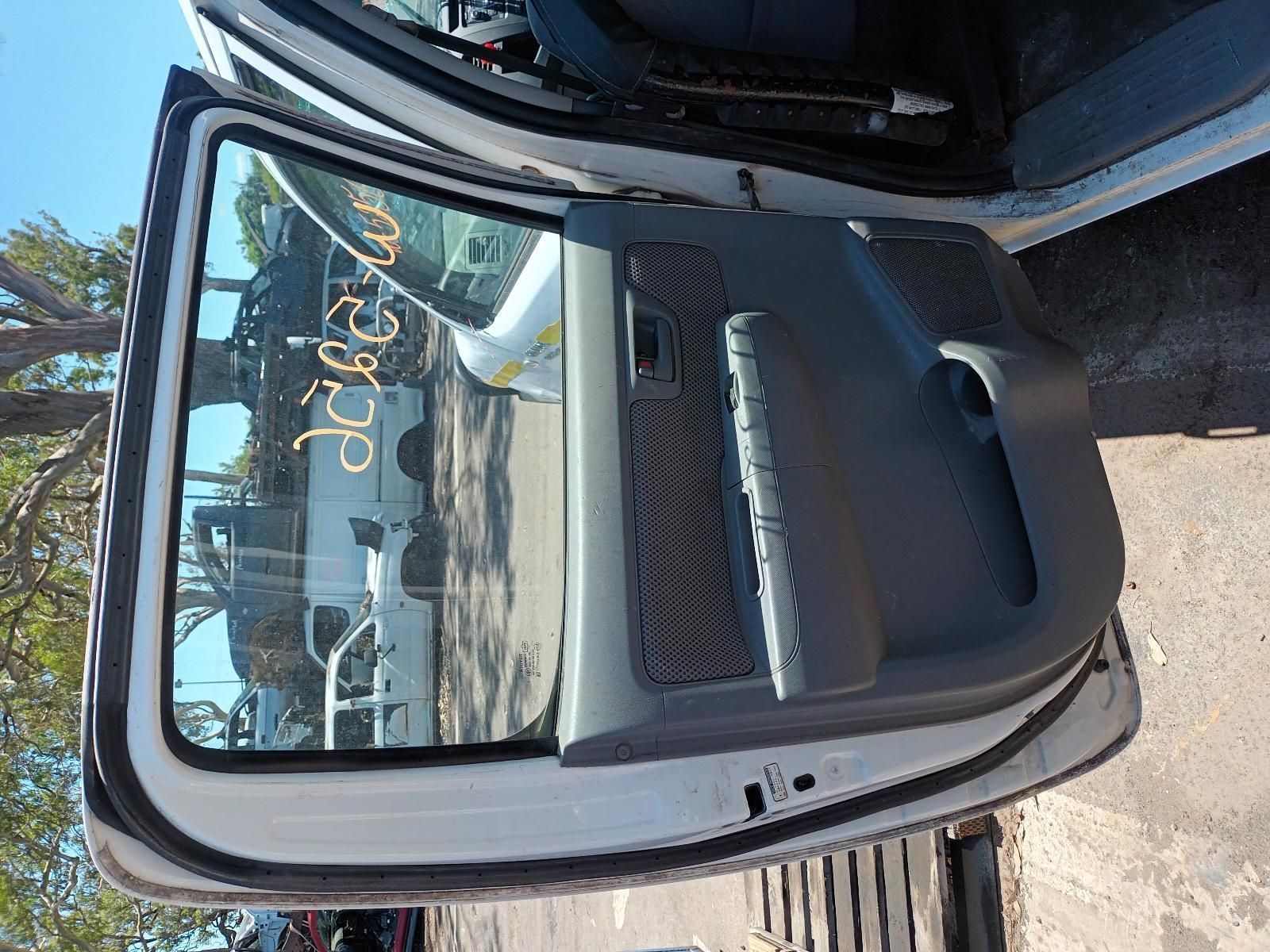 A White Truck with the Door Open is Parked on the Side of the Road — South West 4WD Wreckers in Harristown, QLD