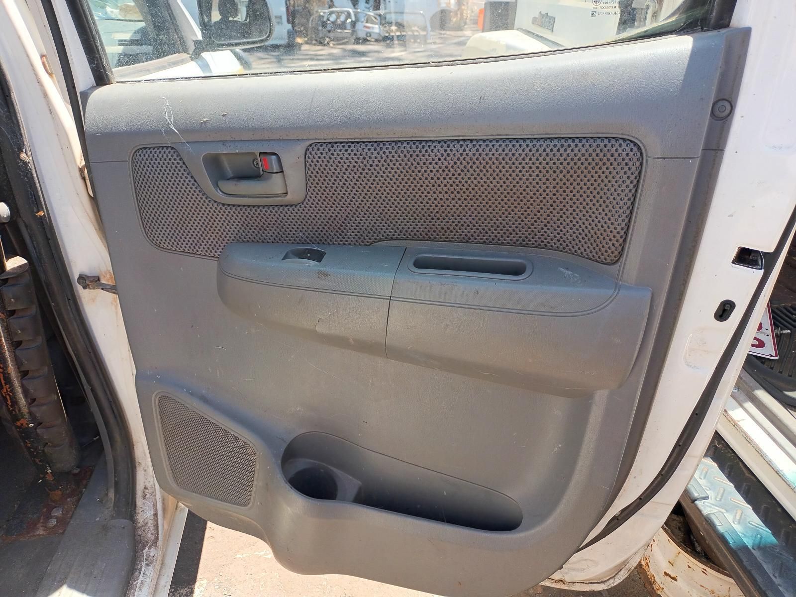A White Car with a Gray Door Panel and a Cup Holder — South West 4WD Wreckers in Harristown, QLD