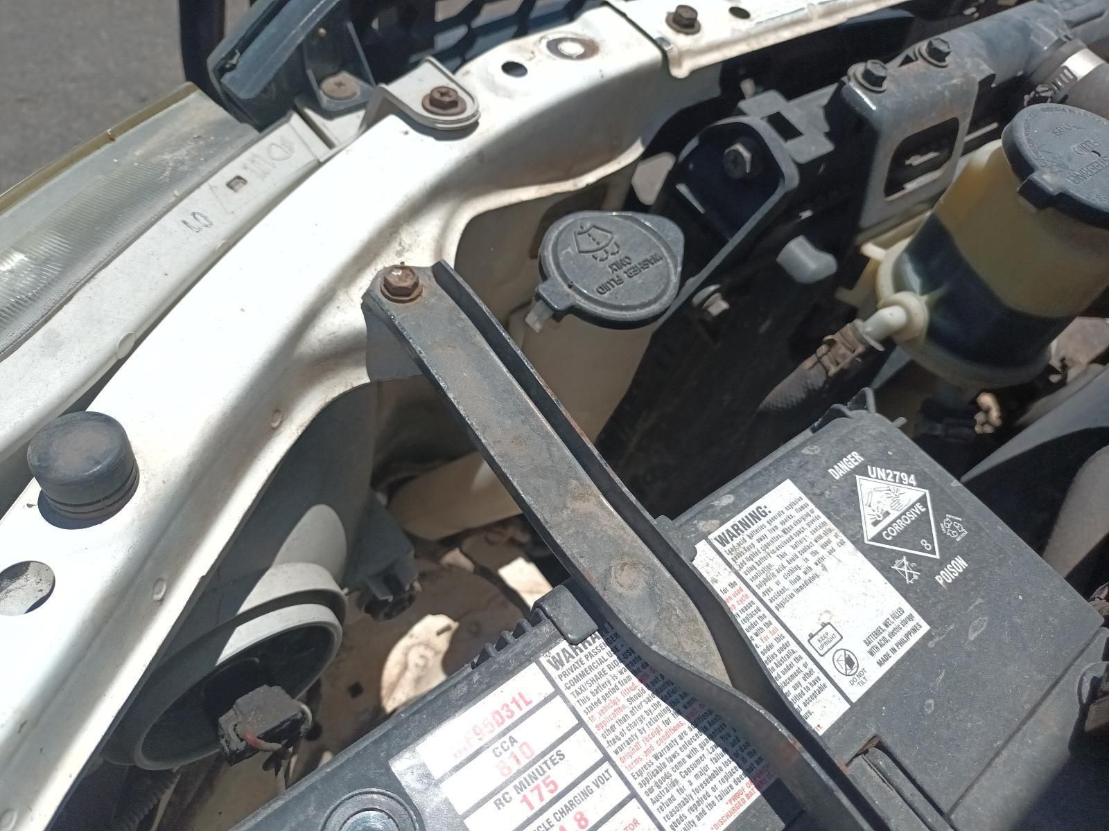 A Close Up of a Car Engine with a Battery in It — South West 4WD Wreckers in Harristown, QLD