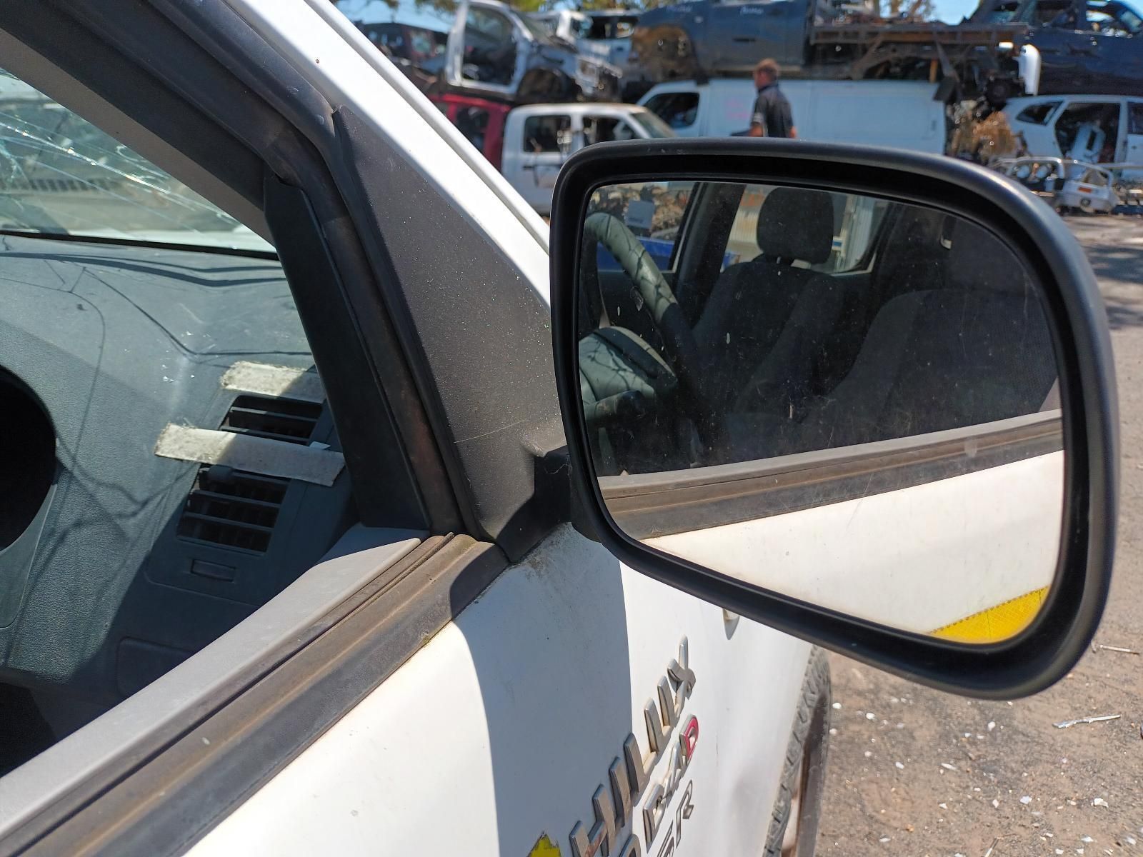 A Rear View Mirror on a White Car with the Word Toyota on the Side — South West 4WD Wreckers in Harristown, QLD