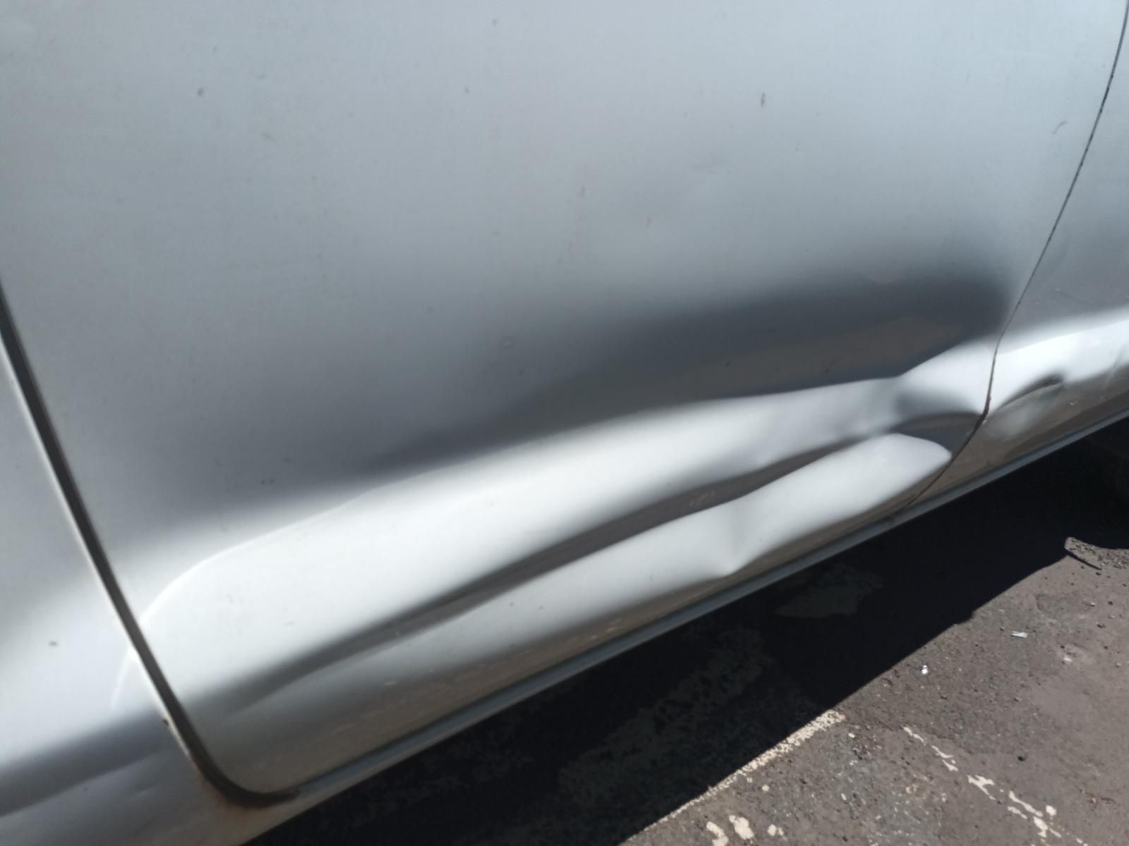 A Silver Car with a Damaged Side Door — South West 4WD Wreckers in Harristown, QLD