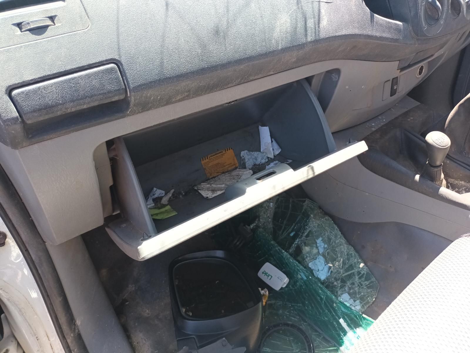 The Glove Box of a Car is Open and Filled with Trash — South West 4WD Wreckers in Harristown, QLD