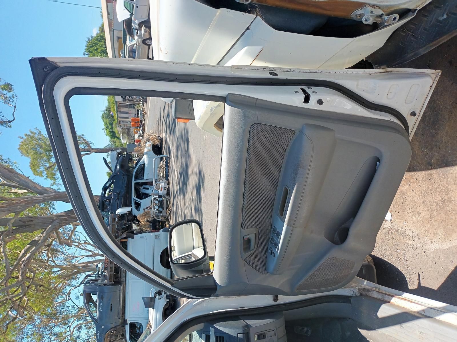 A White Car with the Door Open and a Mirror — South West 4WD Wreckers in Harristown, QLD