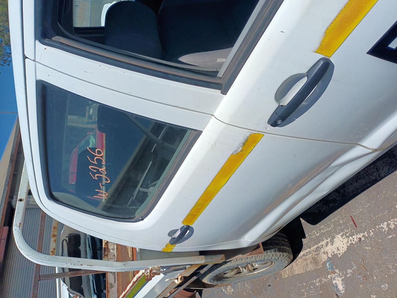 A White Truck with Yellow Stripes on the Side is Parked on the Side of the Road — South West 4WD Wreckers in Harristown, QLD