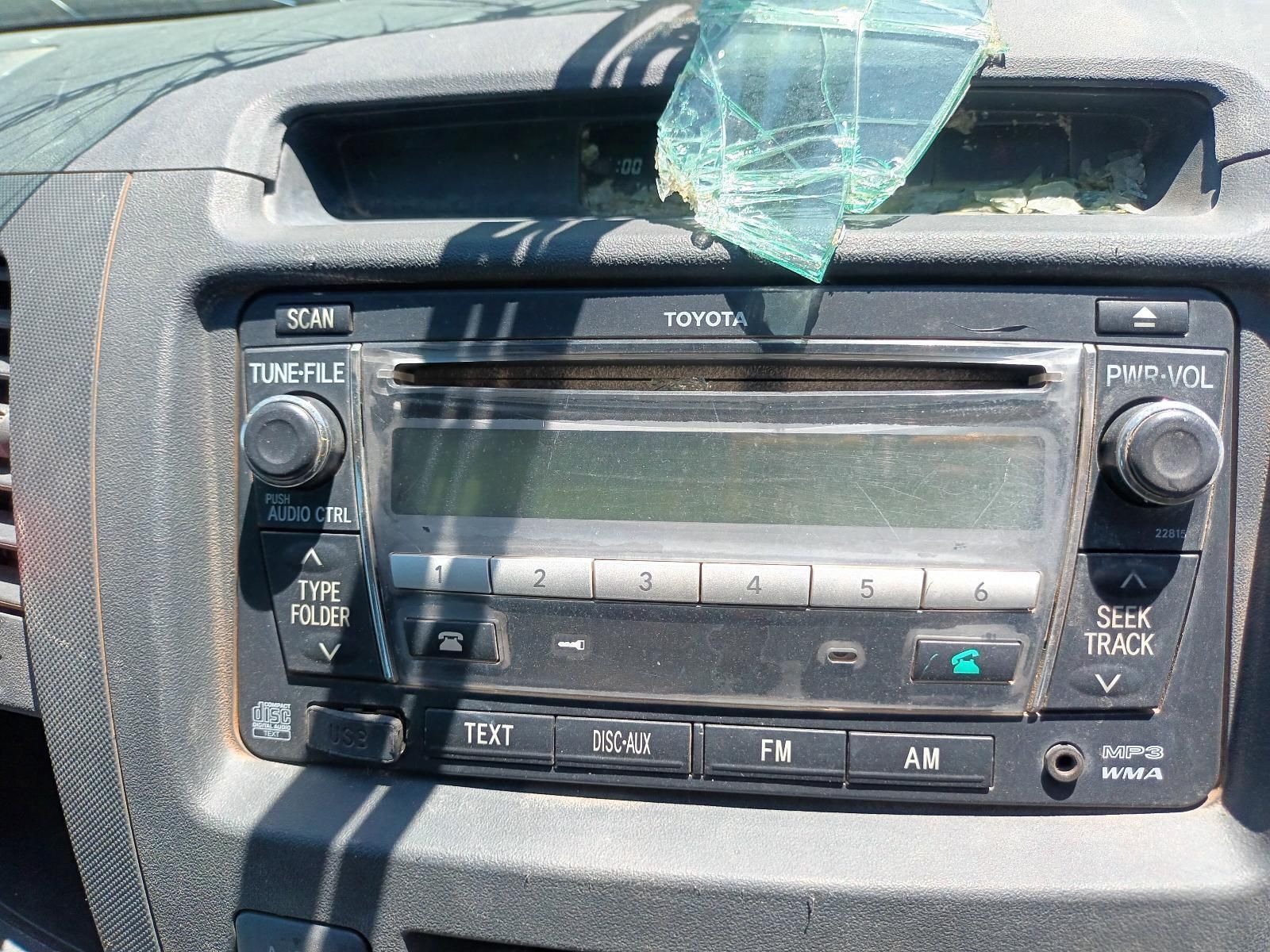 A Toyota Radio is Sitting on the Dashboard of a Car — South West 4WD Wreckers in Harristown, QLD