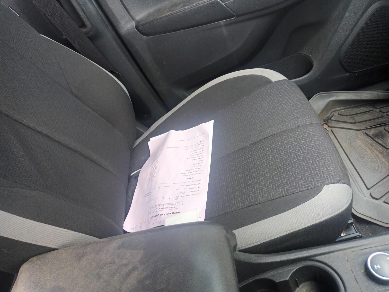 A Car Seat with a Piece of Paper on It — South West 4WD Wreckers In Brisbane, QLD