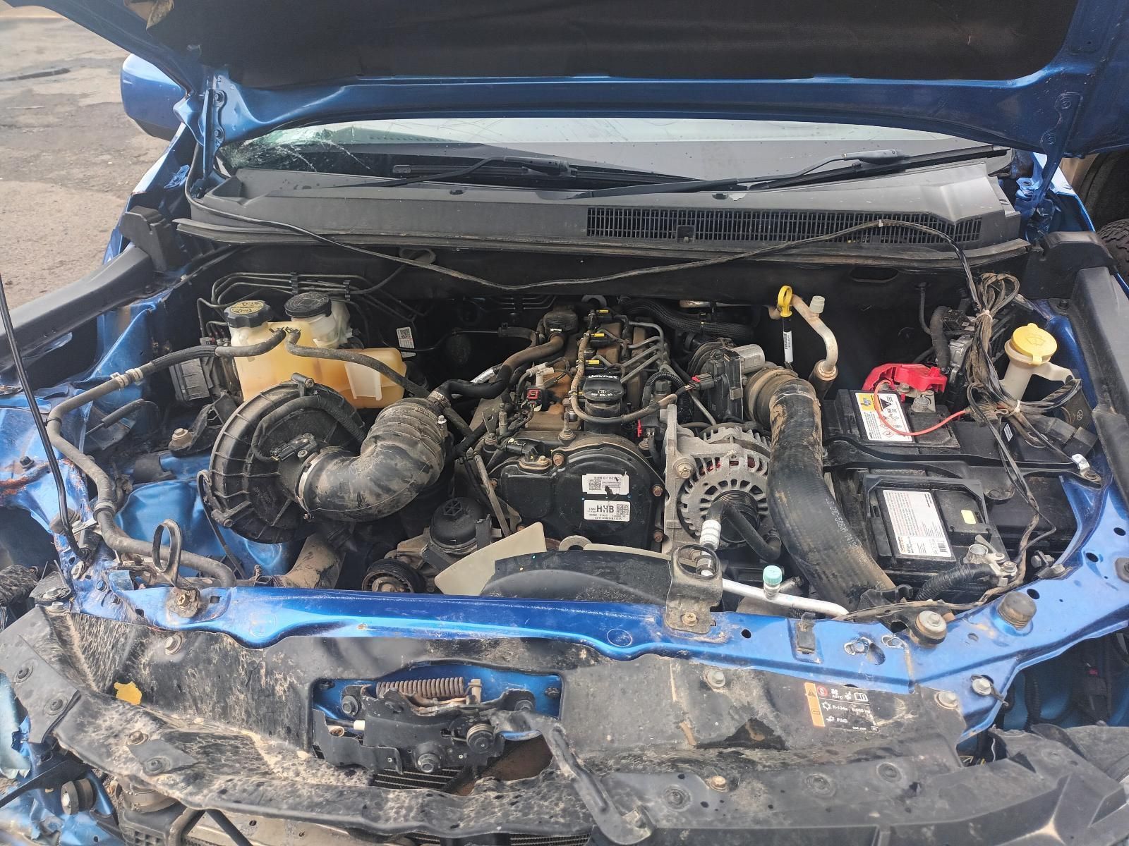The Engine of a Blue Car is Shown with the Hood Open — South West 4WD Wreckers In Brisbane, QLD