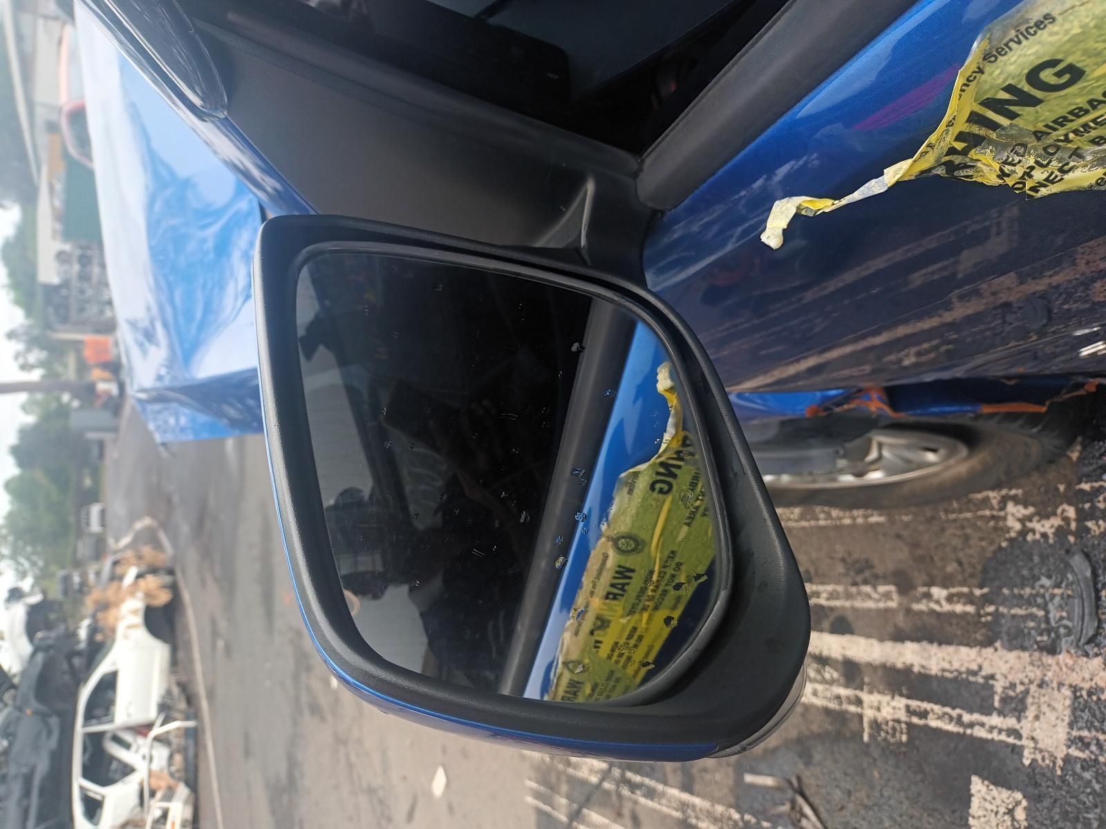 A Blue Car with a Yellow Caution Tape on It — South West 4WD Wreckers In Brisbane, QLD