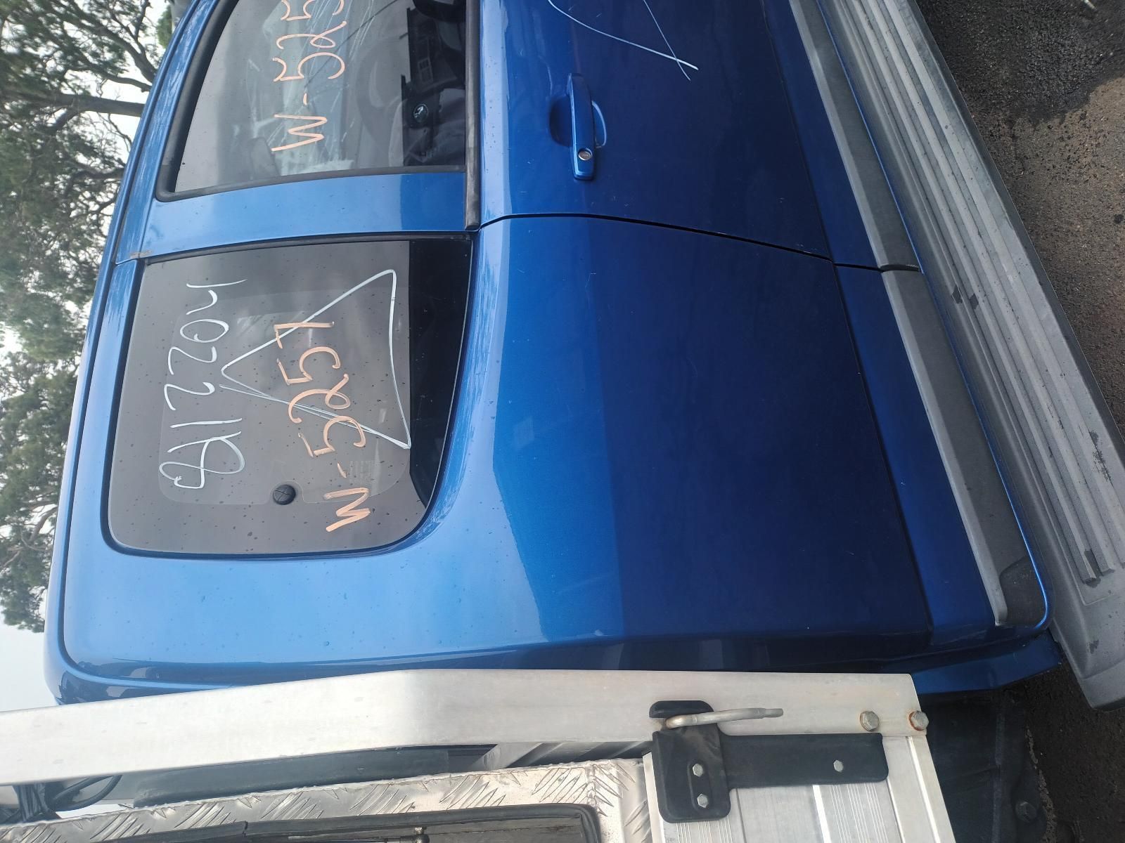 A Blue Truck is Parked on the Side of the Road — South West 4WD Wreckers In Brisbane, QLD
