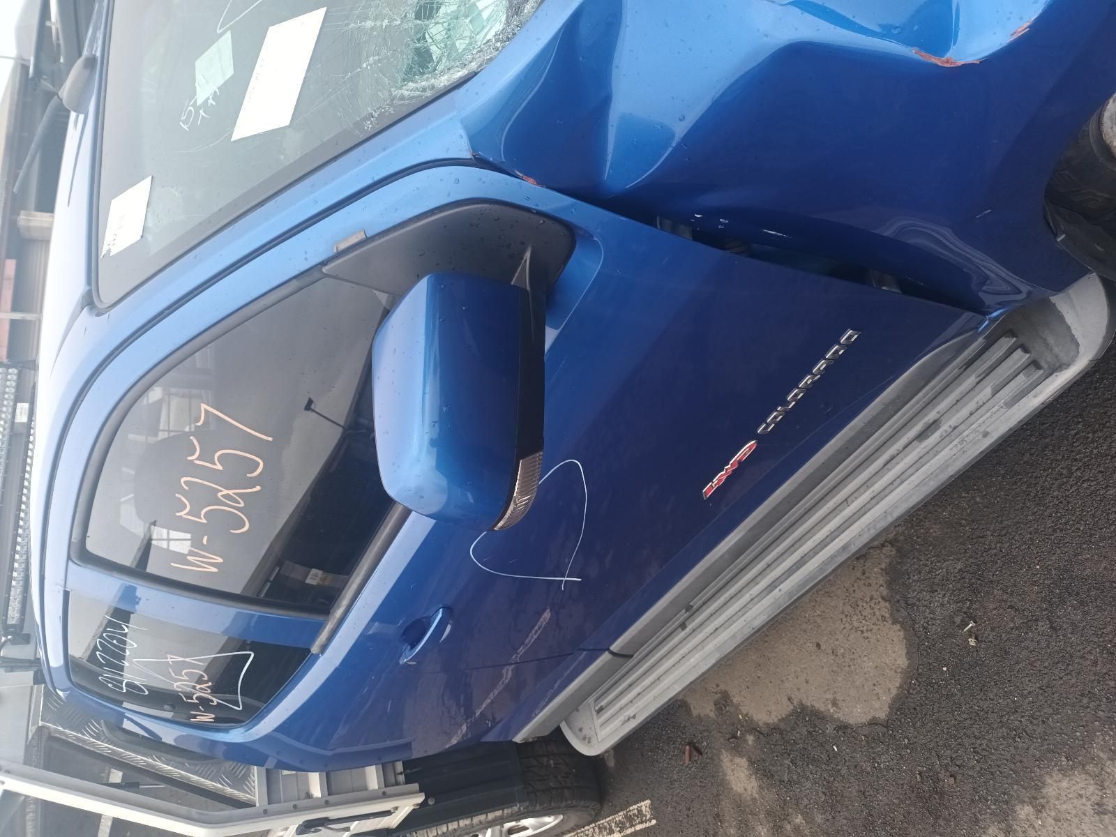 A Blue Truck with a Broken Windshield is Parked on the Side of the Road — South West 4WD Wreckers In Brisbane, QLD