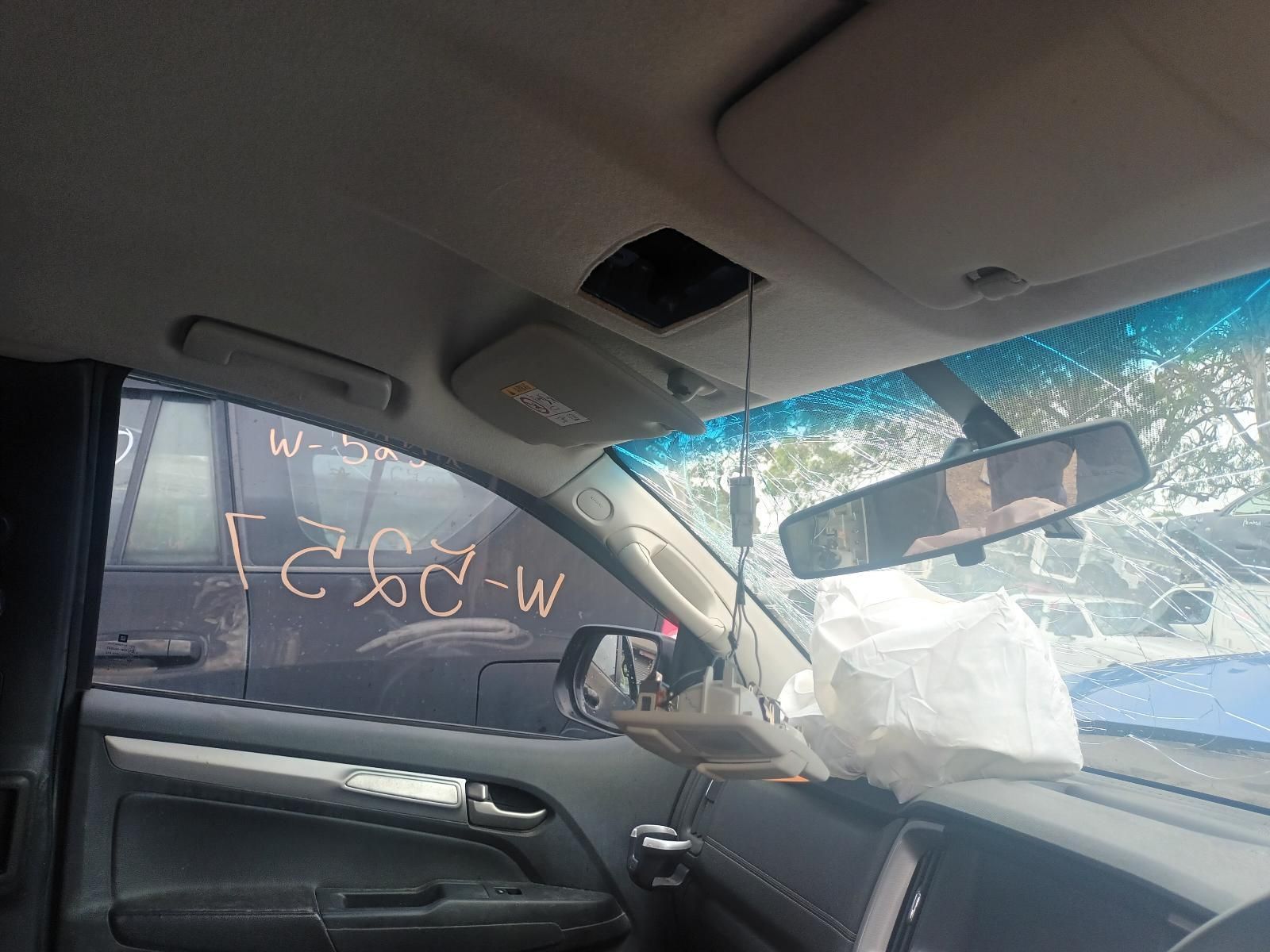 The Inside of a Car with the Rear View Mirror Hanging from the Ceiling — South West 4WD Wreckers In Brisbane, QLD