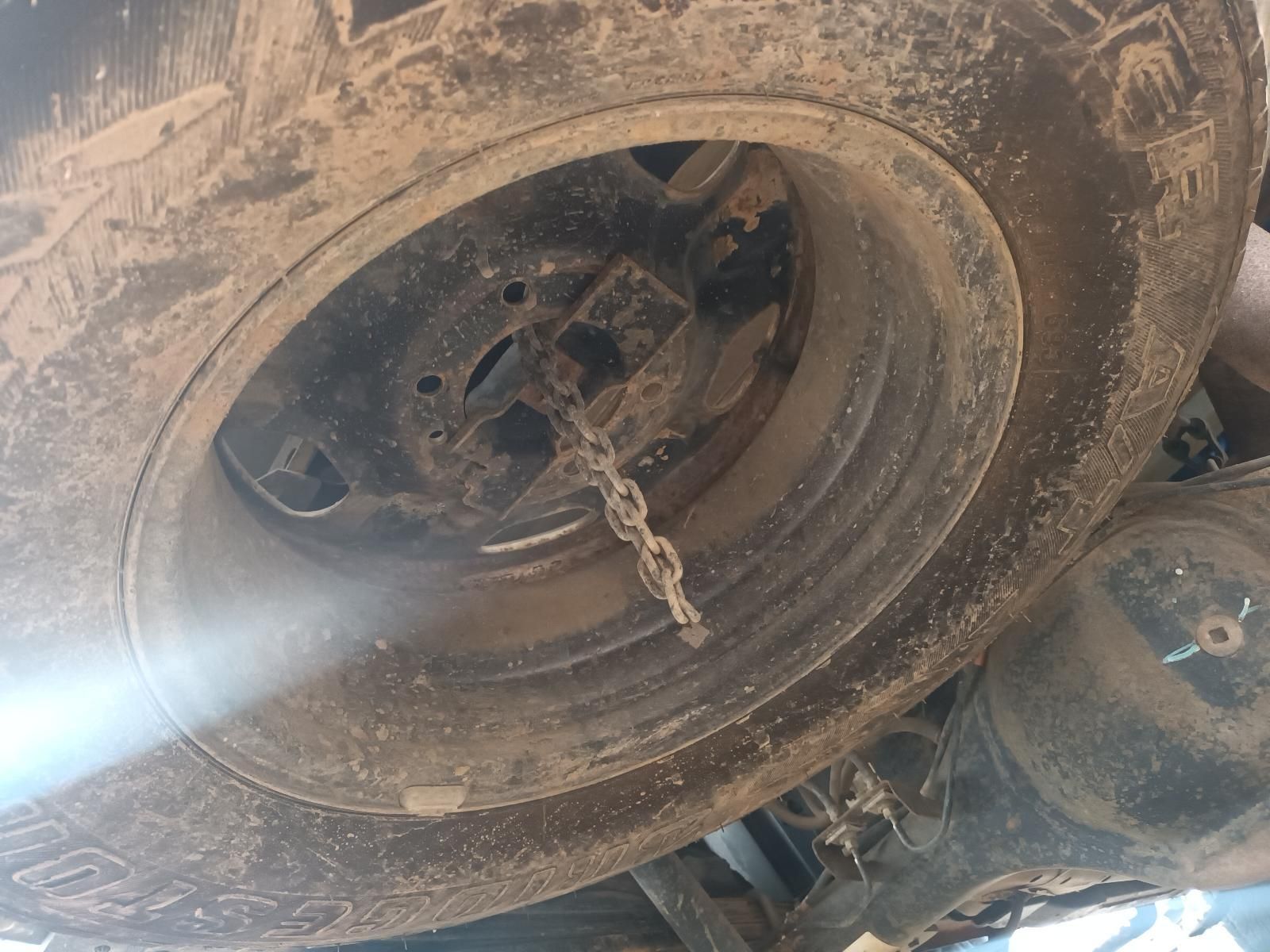 A Close Up of a Tire with a Chain Coming Out of It — South West 4WD Wreckers In Brisbane, QLD