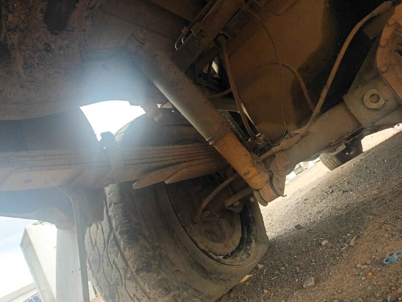 A Close Up of the Underside of a Car with a Tire — South West 4WD Wreckers In Brisbane, QLD