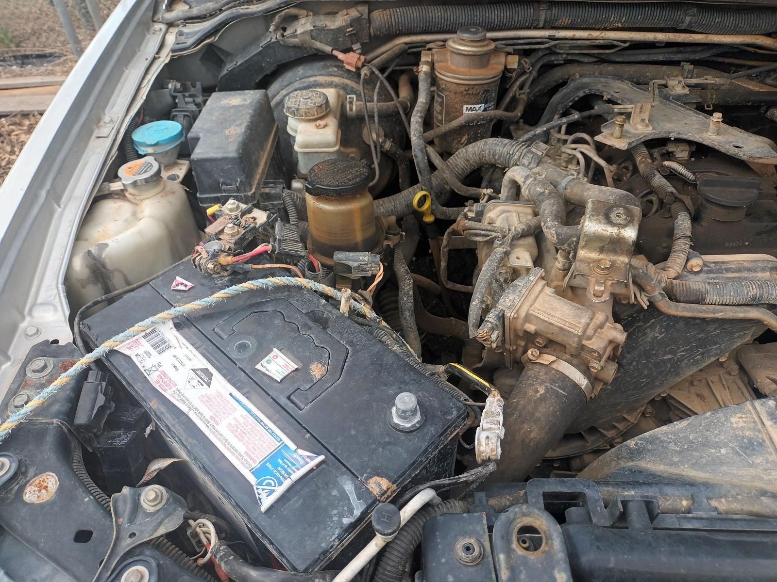 The Engine of a Car with a Battery in It — South West 4WD Wreckers In Brisbane, QLD
