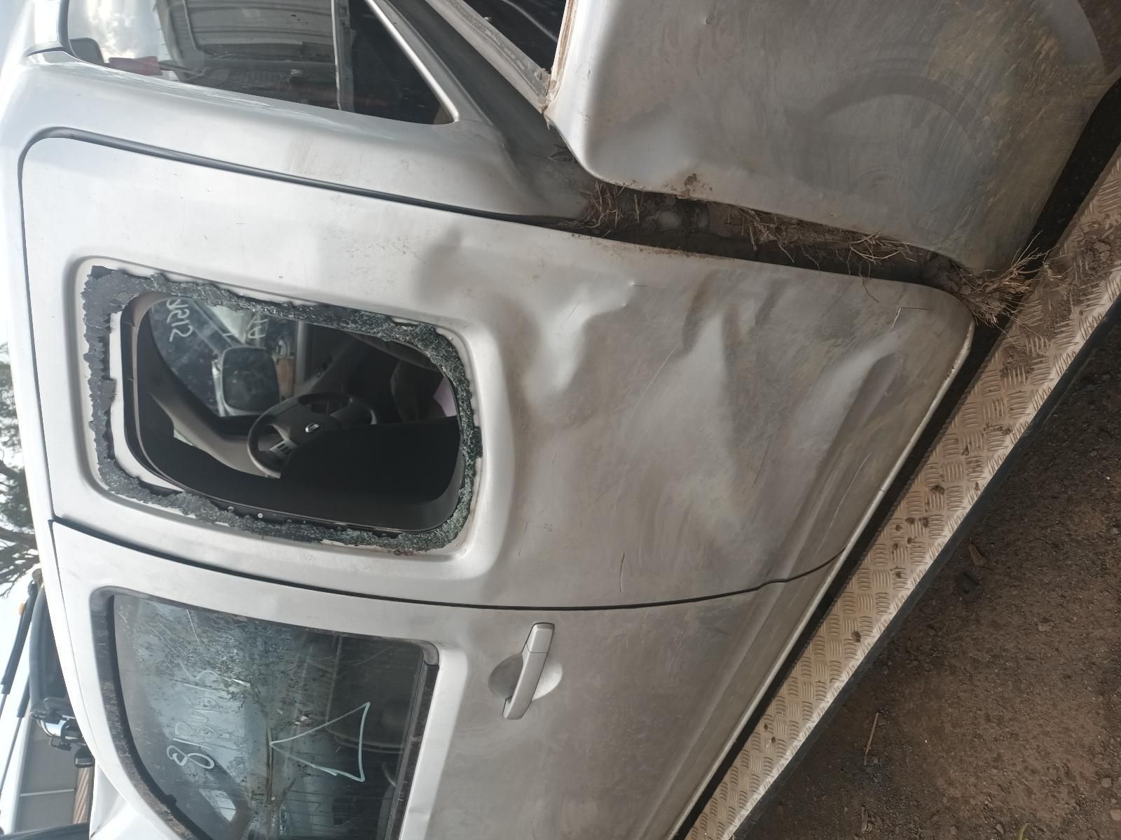 A White Truck With a Broken Window is Sitting on the Ground — South West 4WD Wreckers In Brisbane, QLD