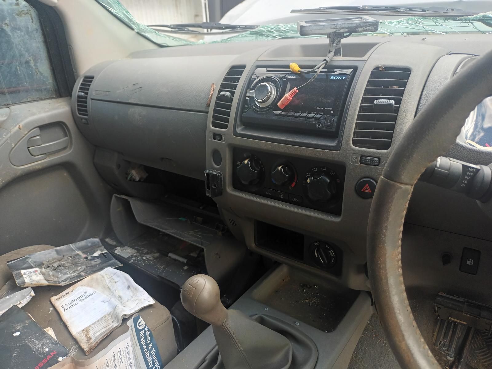 A Dirty Dashboard of a Car with a Broken Windshield — South West 4WD Wreckers In Brisbane, QLD
