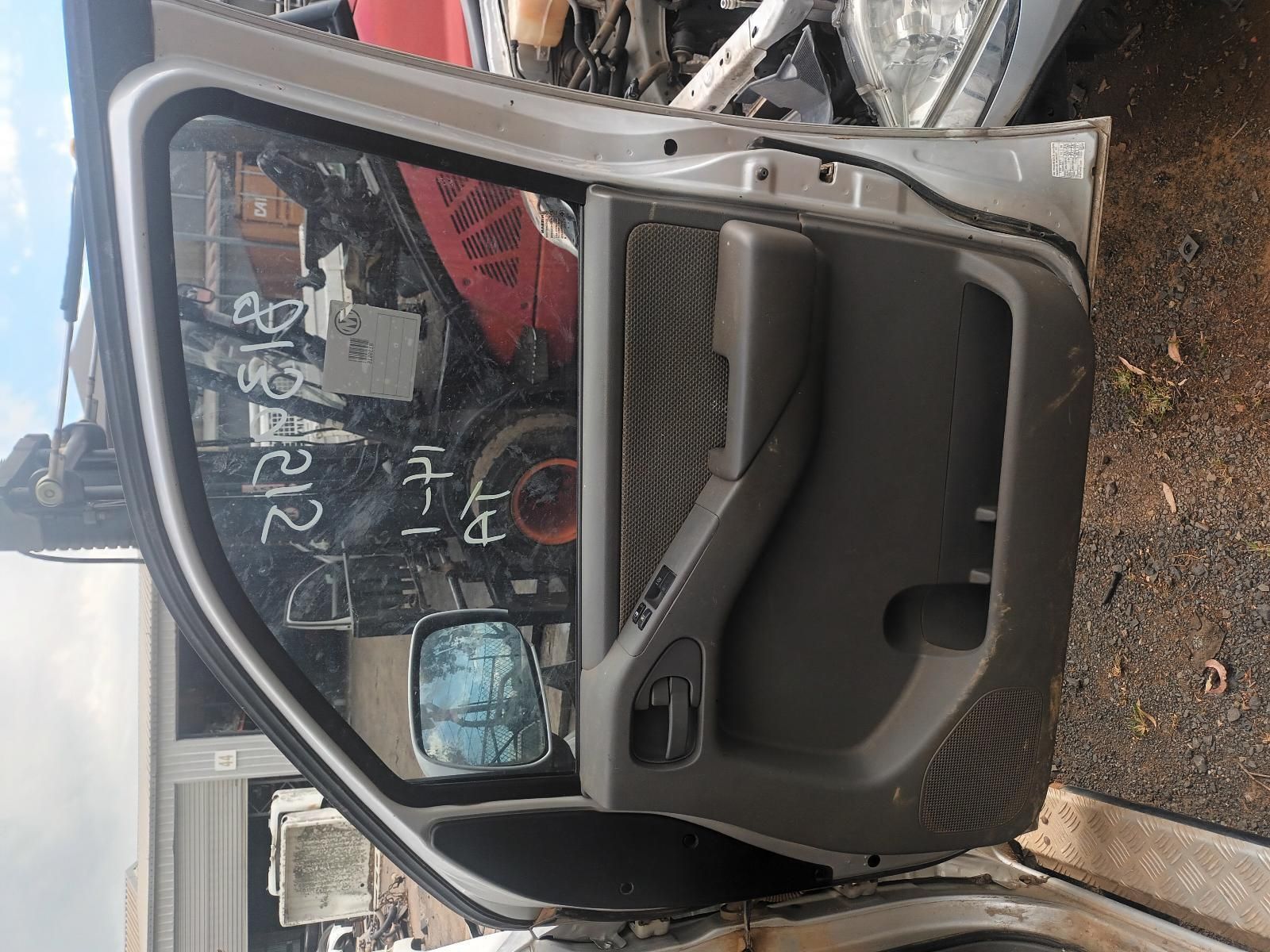 A Car Door is Sitting on the Ground in a Garage — South West 4WD Wreckers In Brisbane, QLD