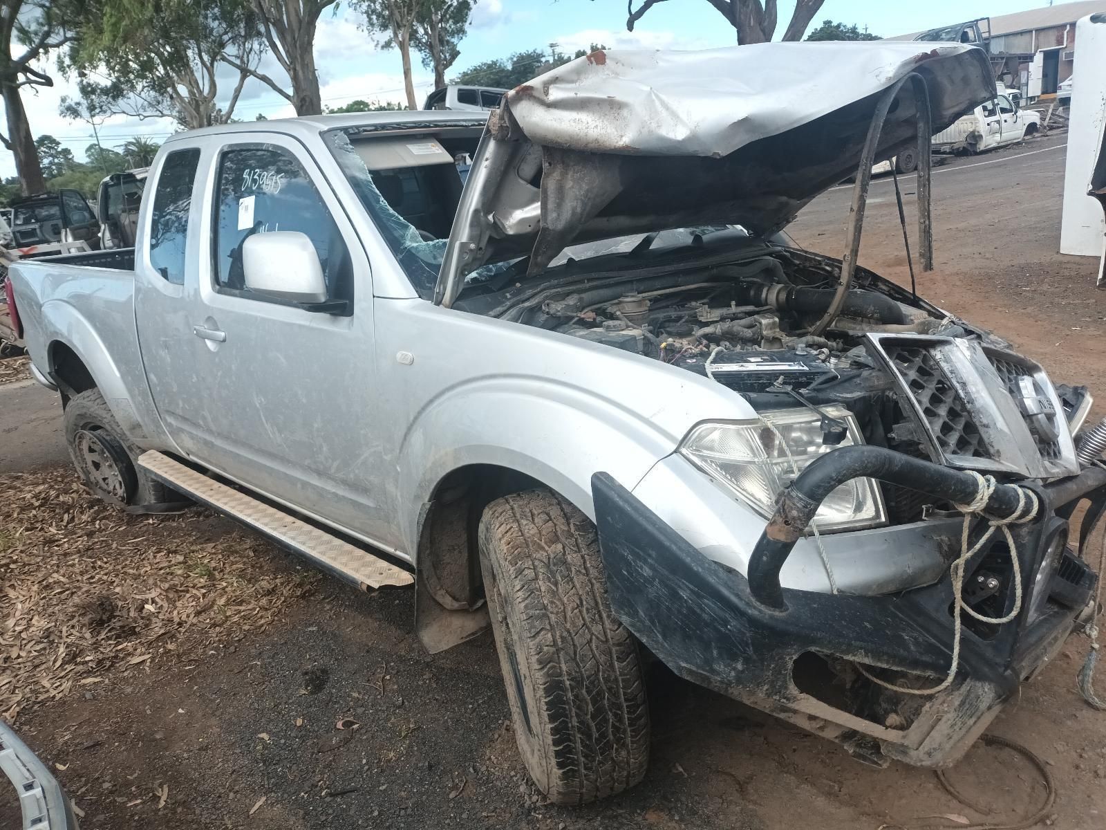 A Silver Truck with the Hood Up is Sitting on the Ground — South West 4WD Wreckers In Brisbane, QLD