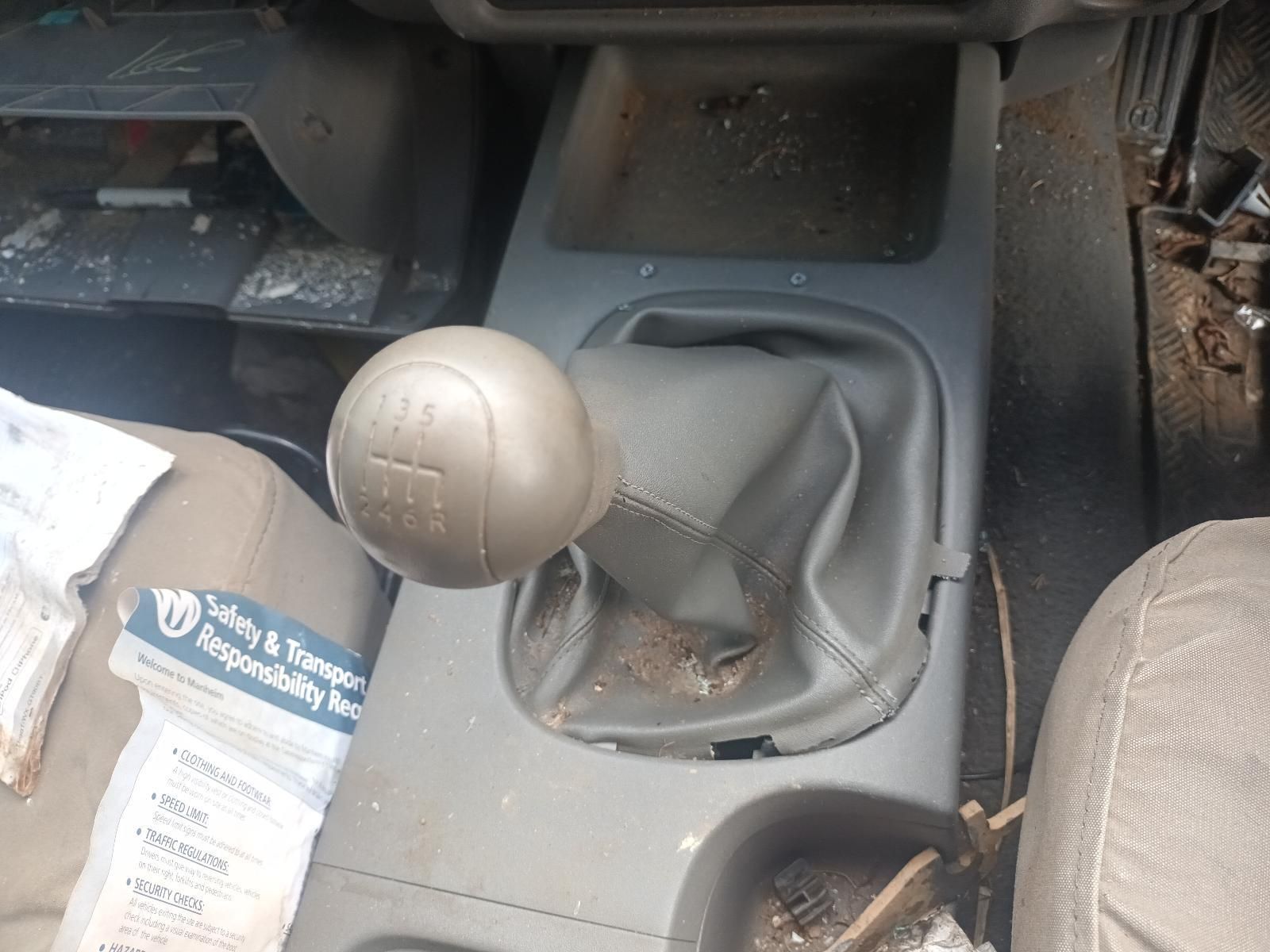 A Dirty Car with a Safety & Responsibility Pamphlet on the Floor — South West 4WD Wreckers In Brisbane, QLD