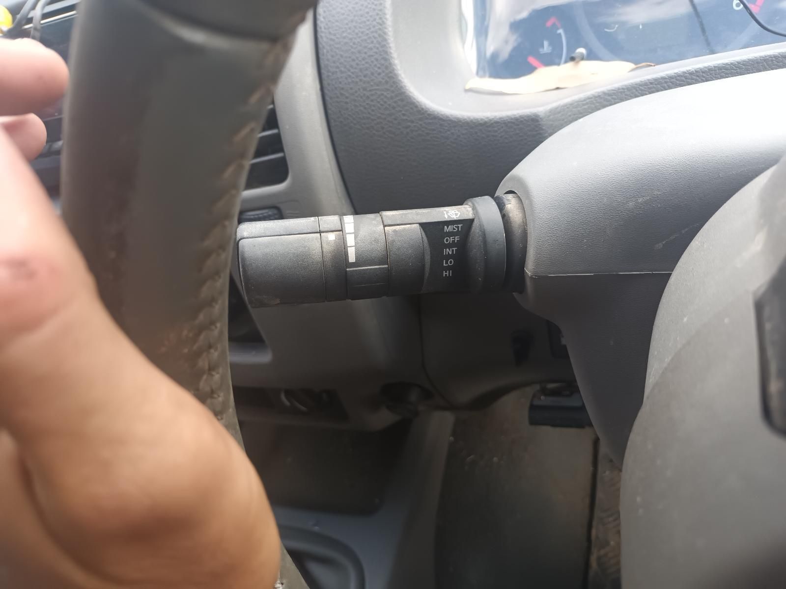 A Person is Holding a Steering Wheel in a Car — South West 4WD Wreckers In Brisbane, QLD