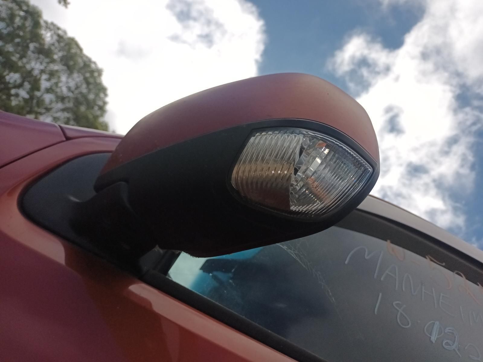 A Close Up of a Side View Mirror on a Red Car — South West 4WD Wreckers In Brisbane, QLD